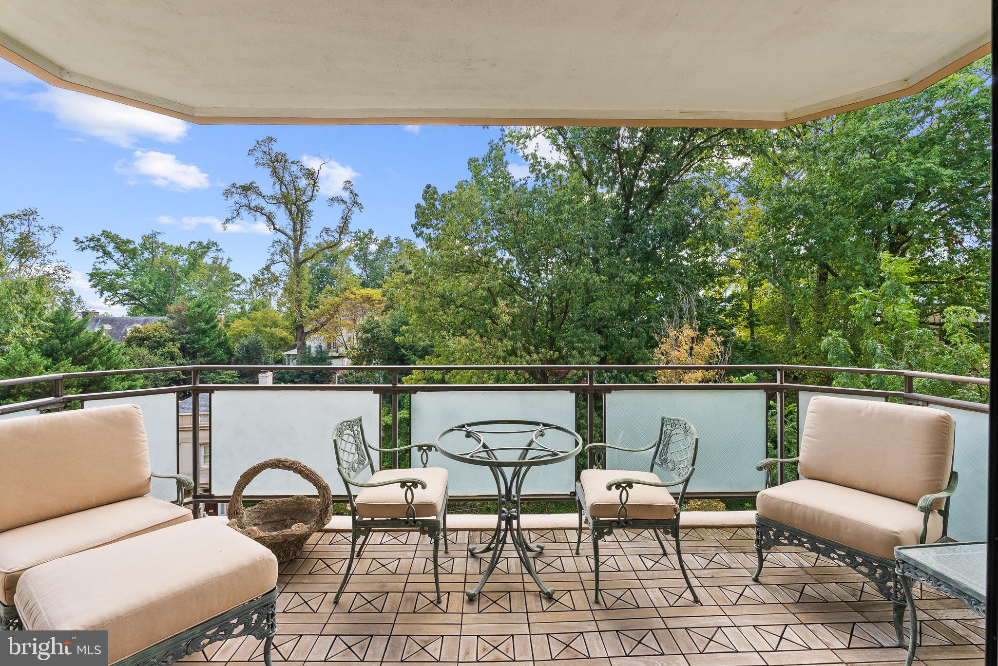 2700 Calvert Street Northwest, Unit 418 Washington, DC 20008 - Photo 4 of 28 a balcony with table and chairs