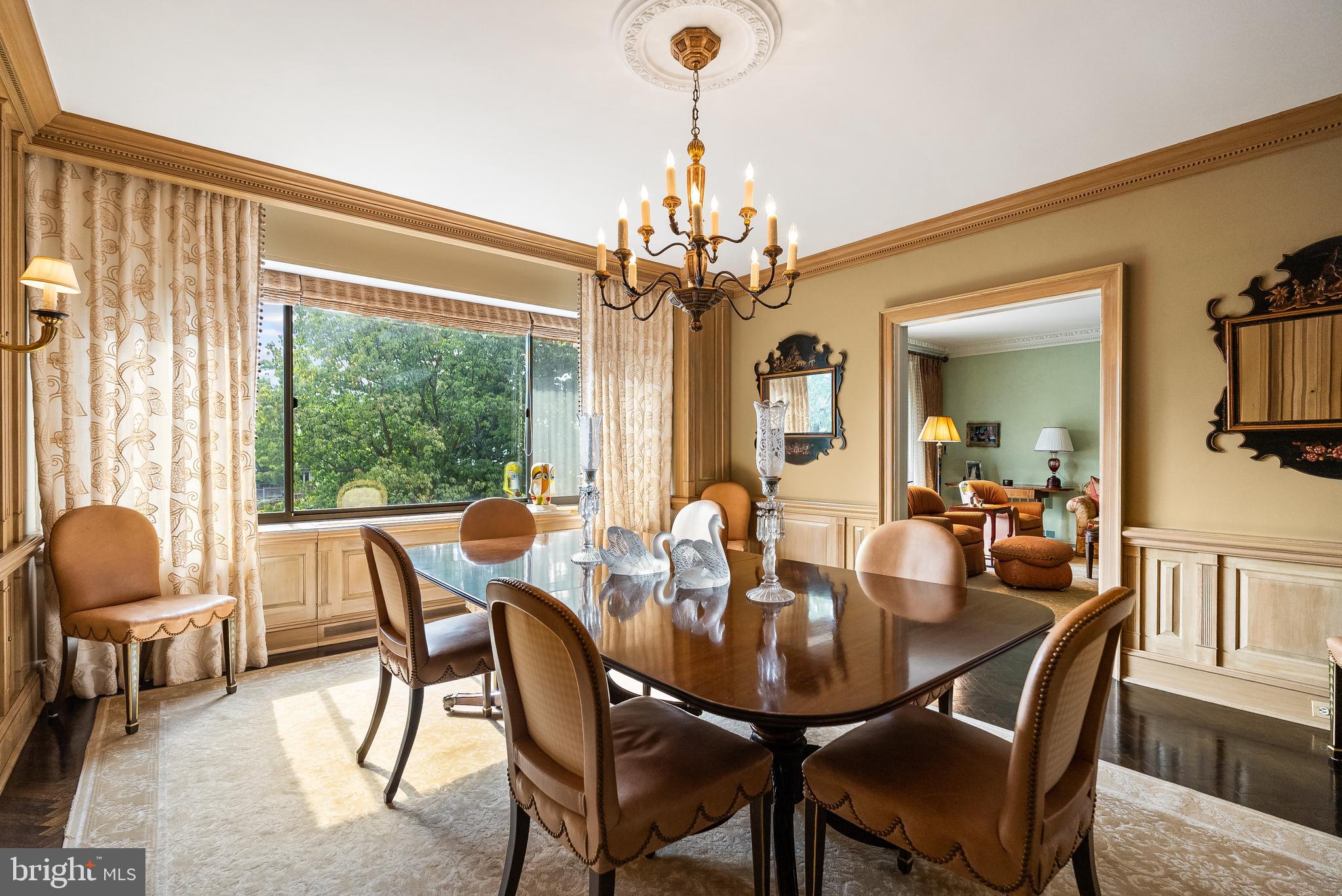 2700 Calvert Street Northwest, Unit 418 Washington, DC 20008 - Photo 6 of 28 a dining room with furniture a chandelier and window