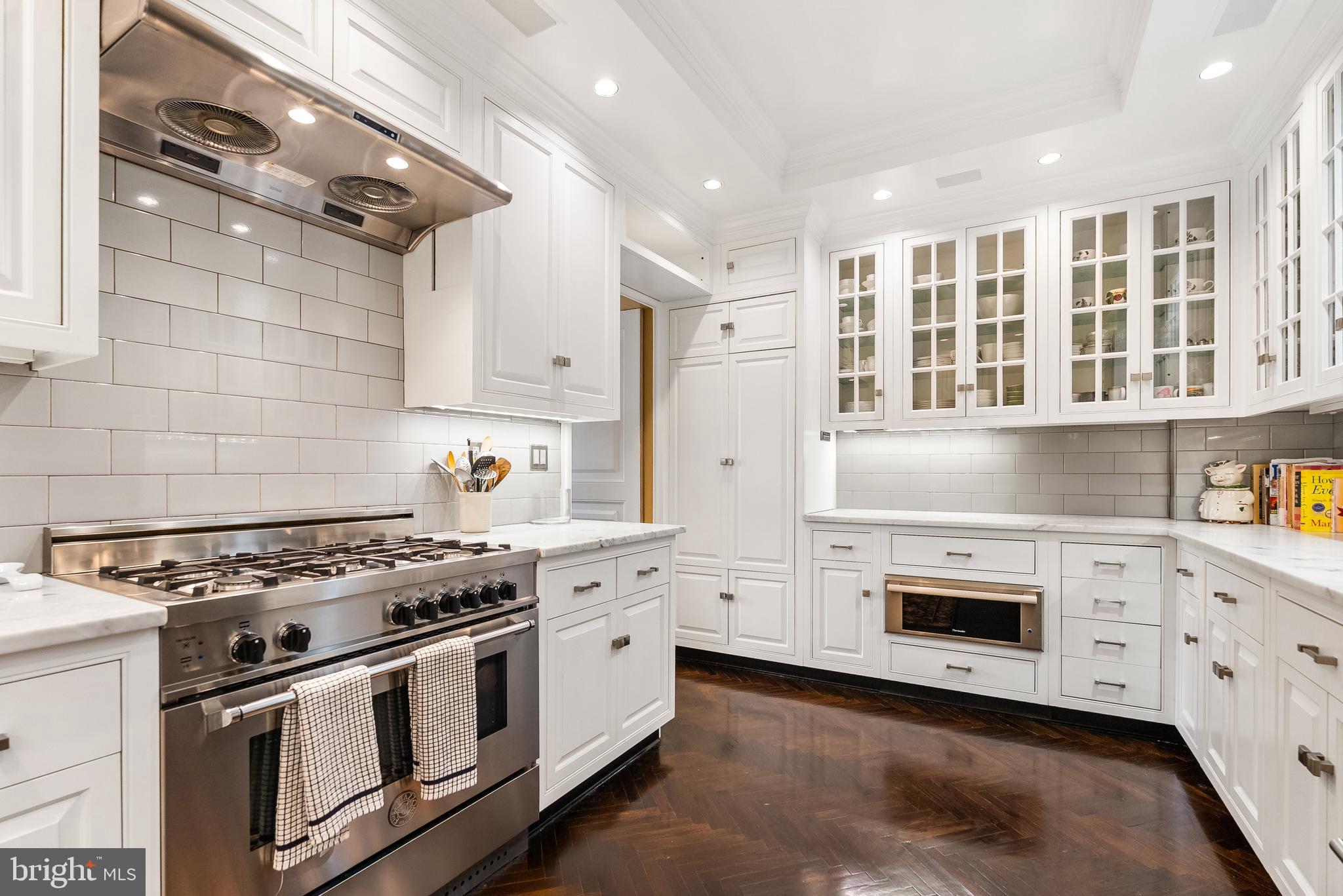 2700 Calvert Street Northwest, Unit 418 Washington, DC 20008 - Photo 9 of 28 a kitchen with stainless steel appliances granite countertop a stove and a refrigerator