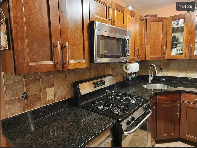 a kitchen with a stove and a microwave