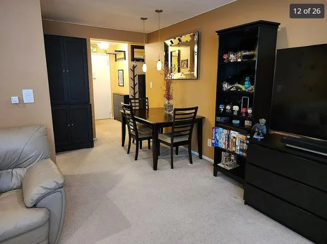 a view of a livingroom with furniture and window