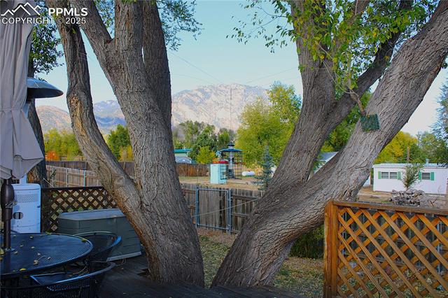 8340 Piute Road Colorado Springs, CO 80926 - Photo 6 of 48 View of mountain background from tree on the deck.