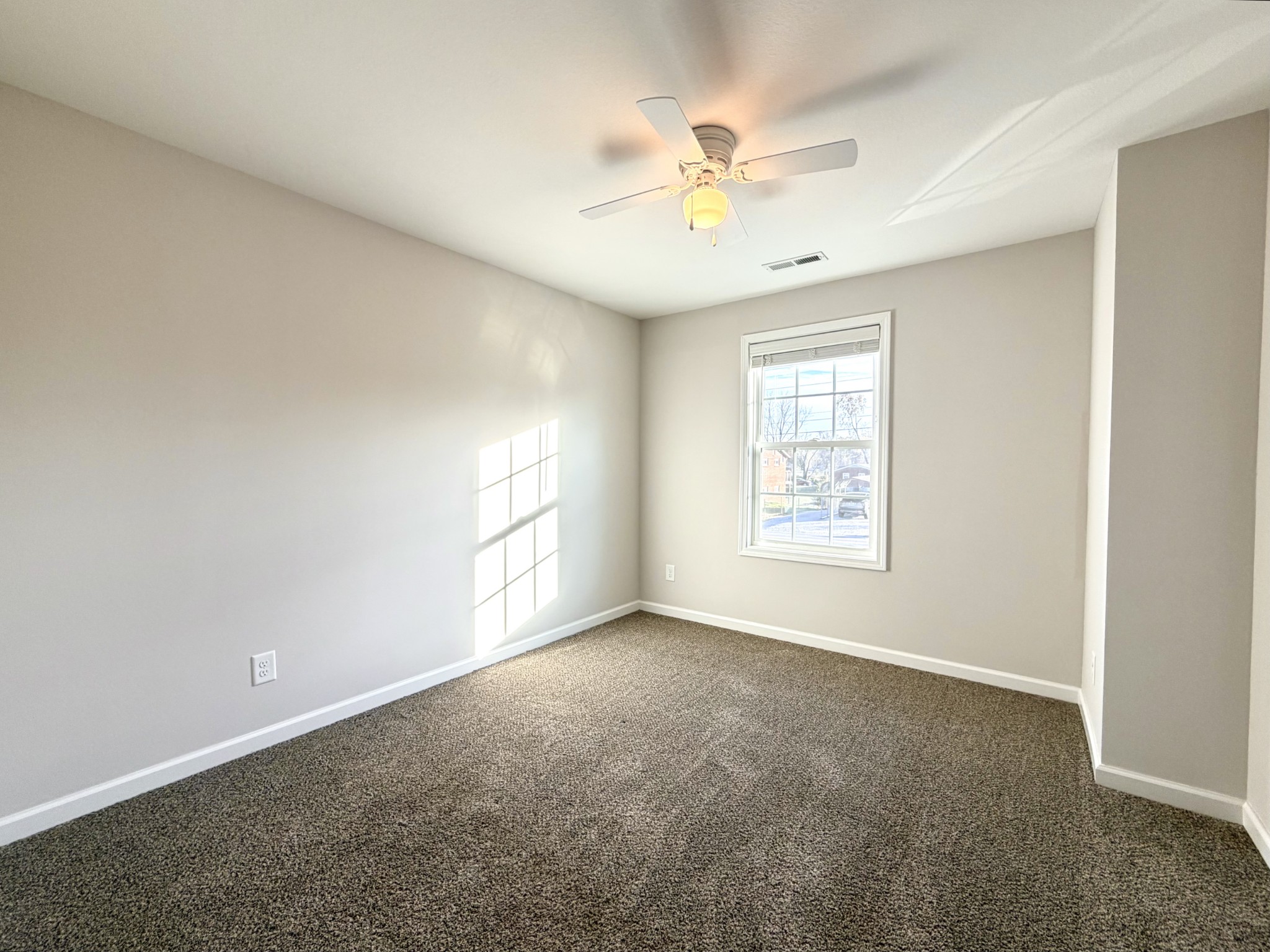 509 Britton Springs Road, Unit B3 Clarksville, TN 37042 - Photo 19 of 20 an empty room with windows and fan