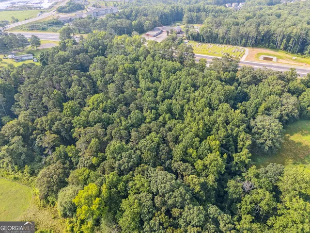 a view of a swimming pool with a yard