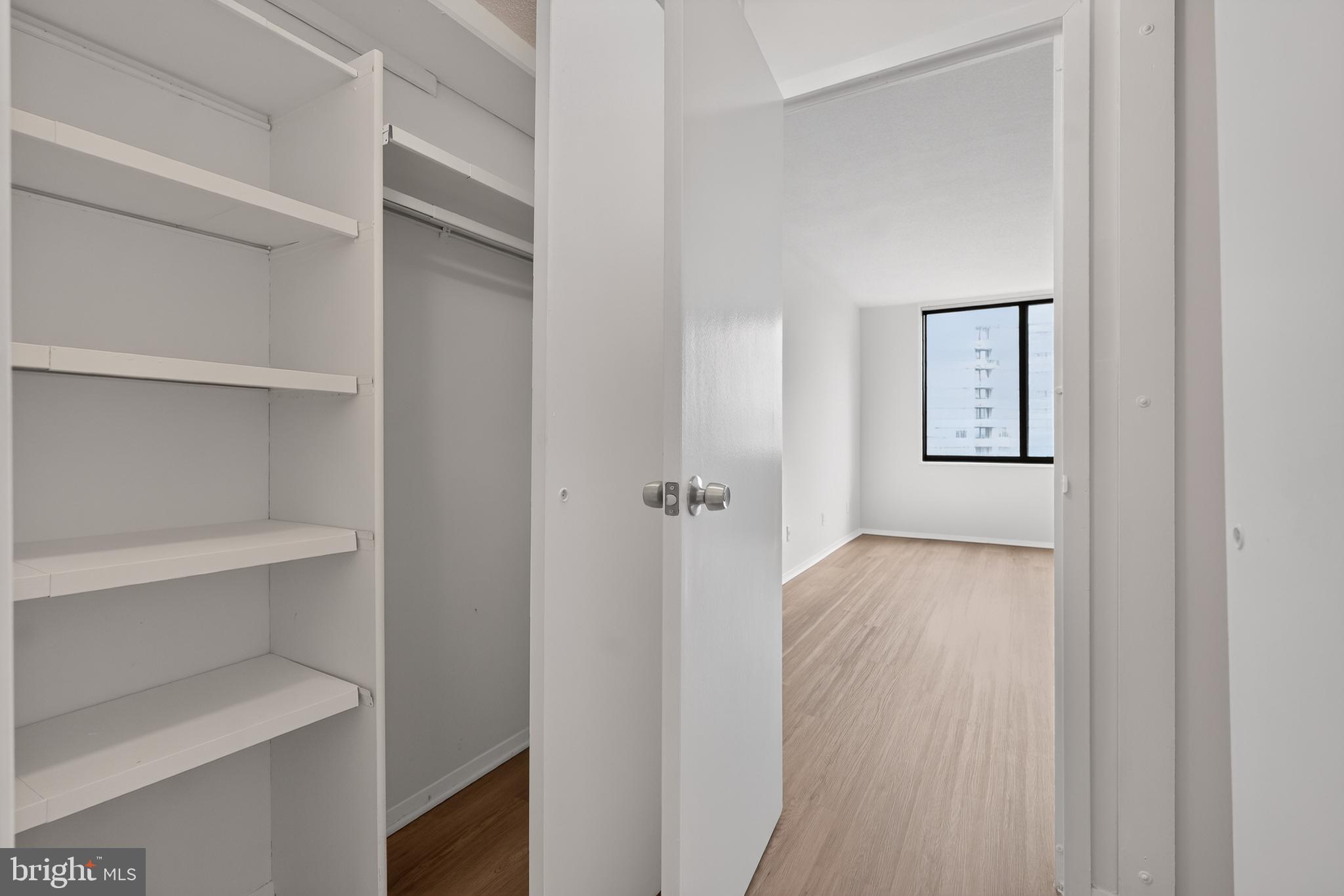 5225 Pooks Hill Road, Unit 1302N Bethesda, MD 20814 - Photo 16 of 19 a view of a hallway with closet
