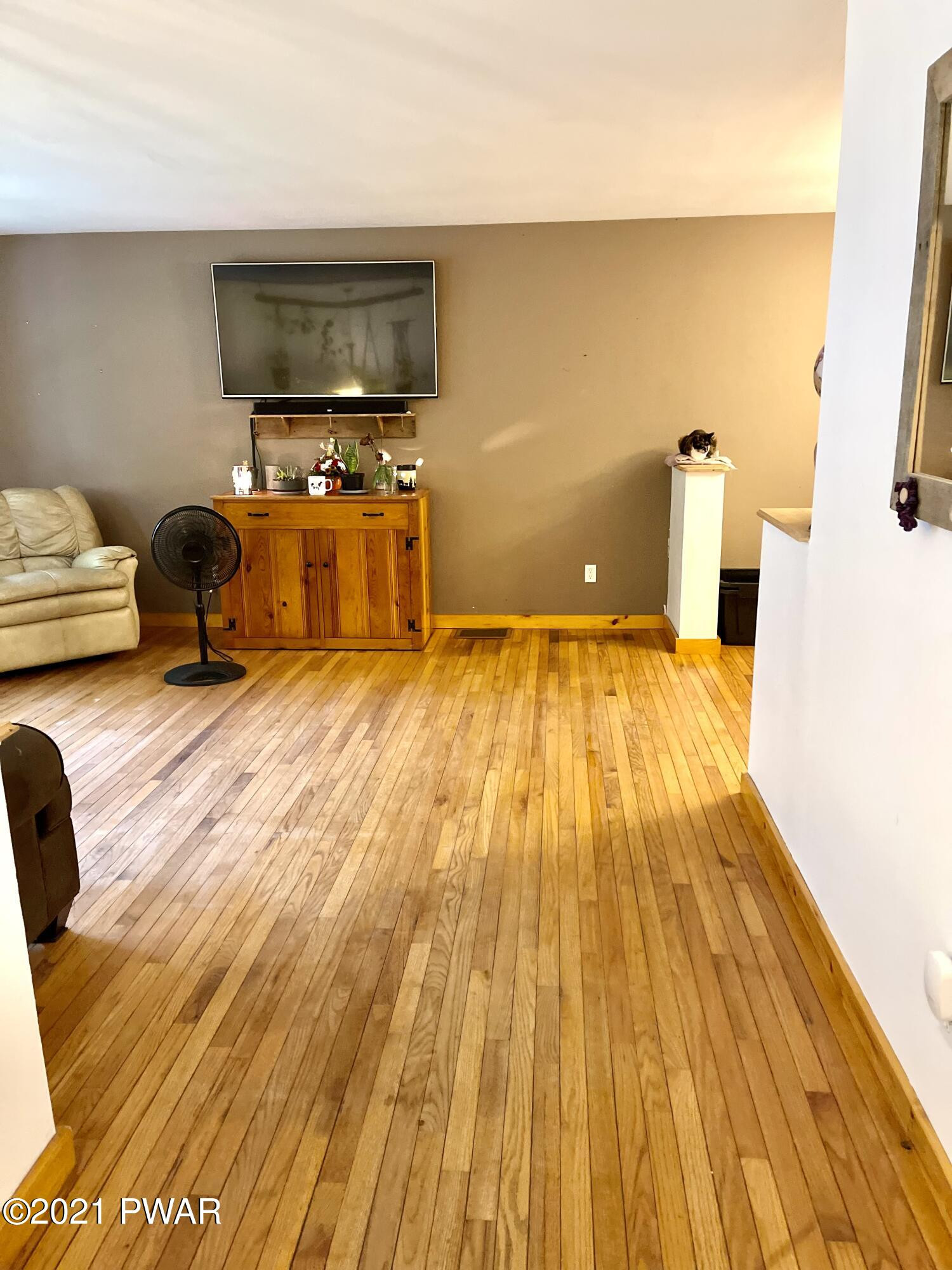 127 Estates Road Greentown, PA 18426 - Photo 63 of 85 a living room with furniture and a flat screen tv