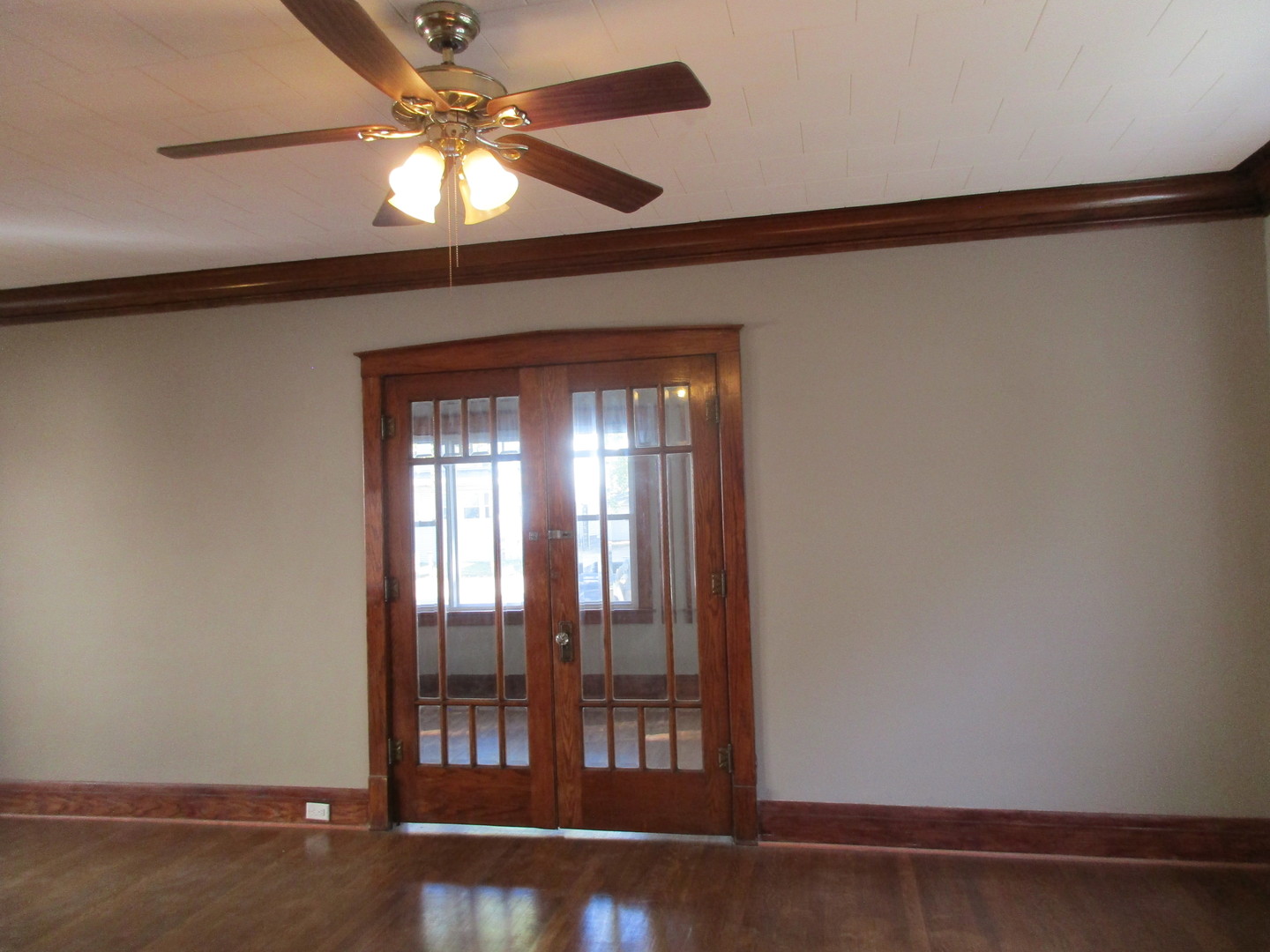 369 South Chicago Avenue Kankakee, IL 60901 - Photo 11 of 40 a view of empty room with wooden floor and fan