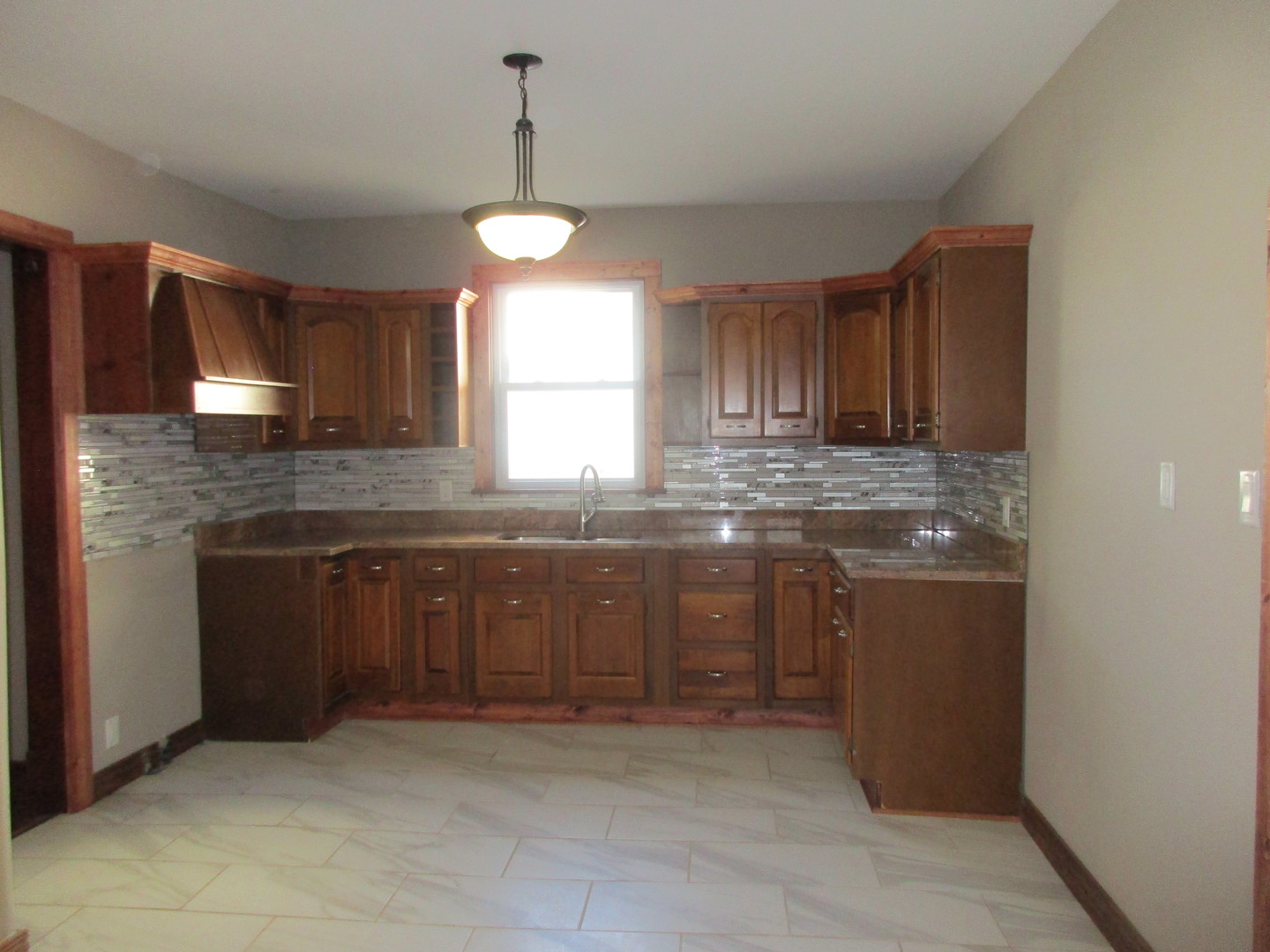369 South Chicago Avenue Kankakee, IL 60901 - Photo 14 of 40 a kitchen with stainless steel appliances granite countertop a stove a sink and a microwave