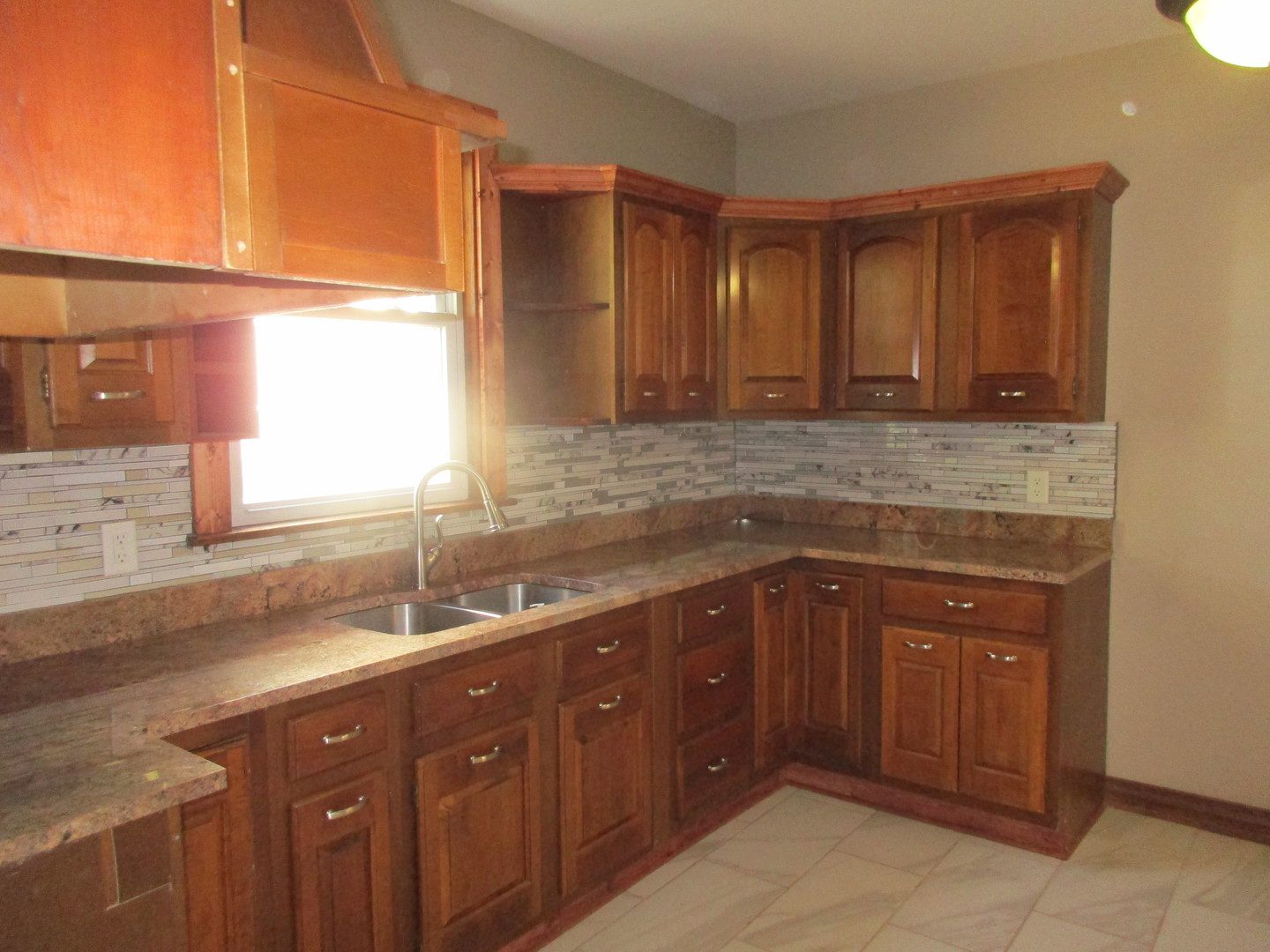 369 South Chicago Avenue Kankakee, IL 60901 - Photo 15 of 40 a kitchen with a sink and a window