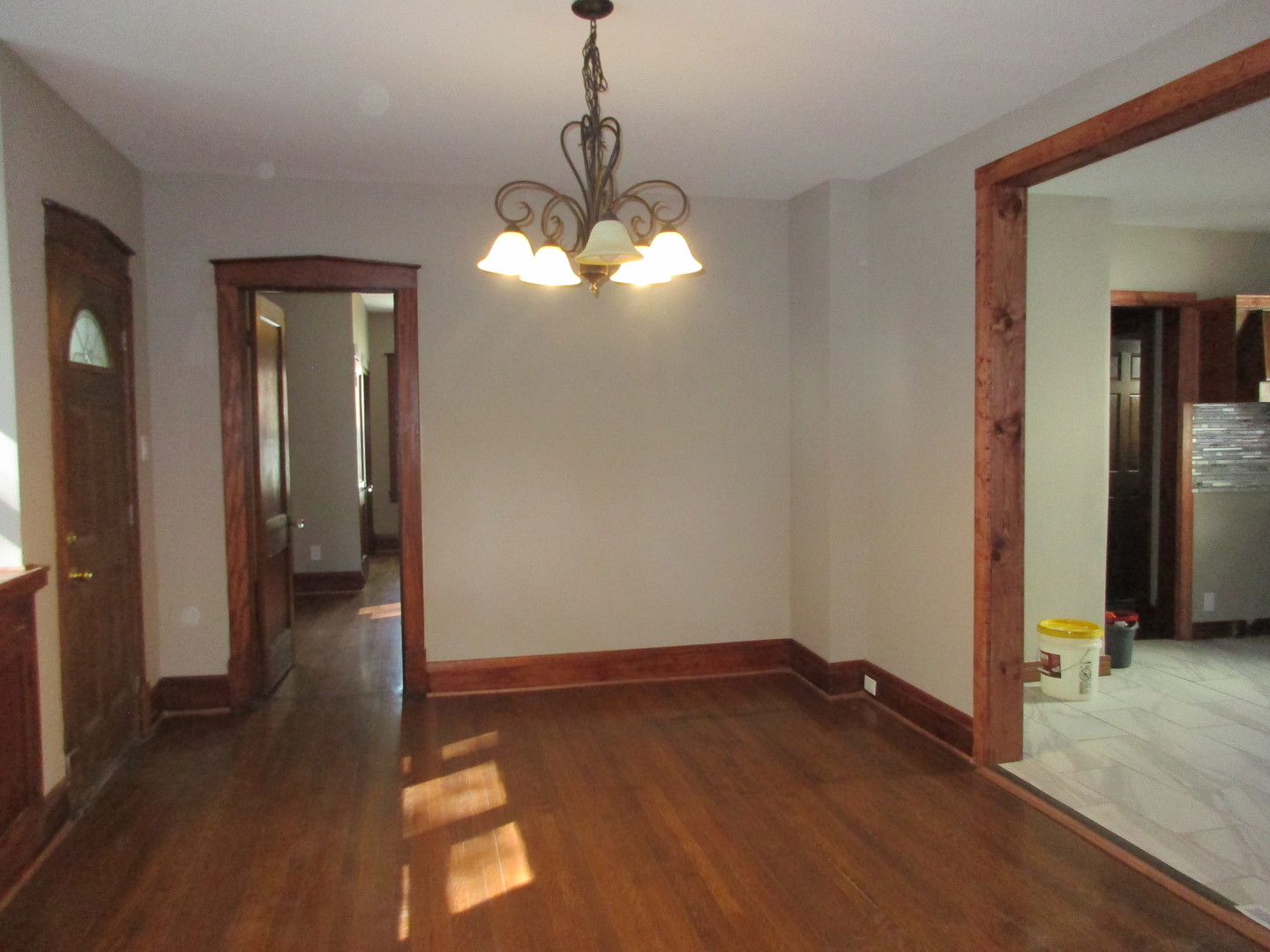 369 South Chicago Avenue Kankakee, IL 60901 - Photo 16 of 40 a view of a room with wooden floor and chandelier
