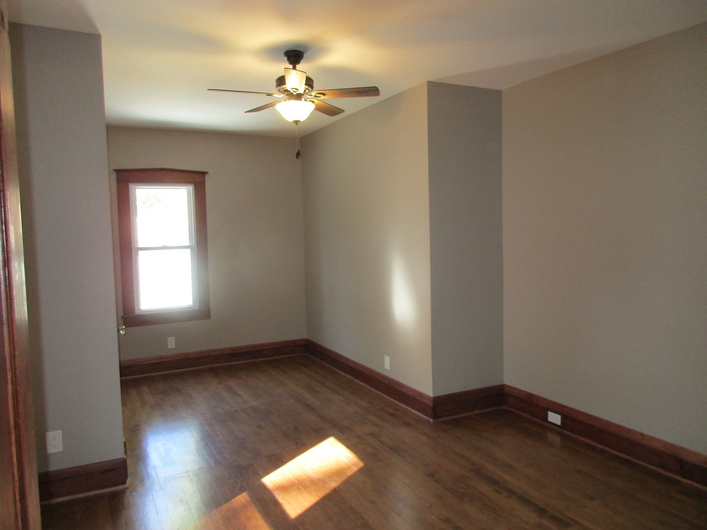 369 South Chicago Avenue Kankakee, IL 60901 - Photo 18 of 40 an empty room with wooden floor and windows