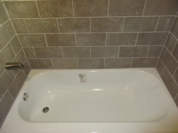 a bathroom with a bath tub