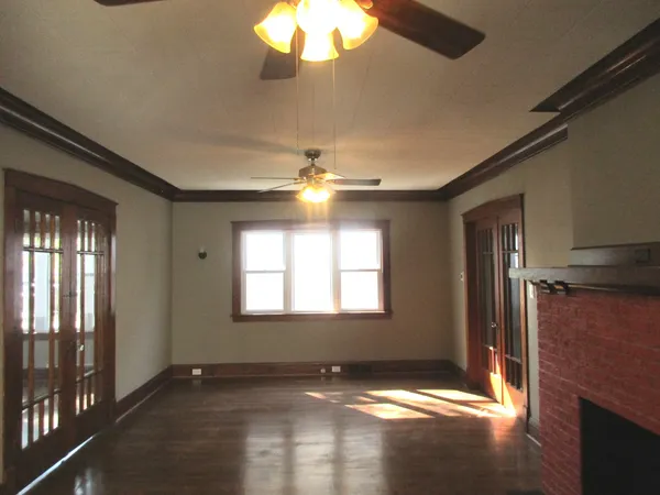 a view of an empty room with a window