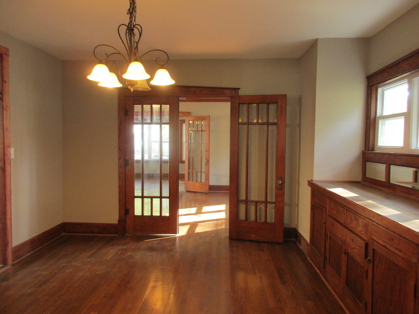 369 South Chicago Avenue Kankakee, IL 60901 - Photo 10 of 40 a view of a room with wooden floor and chandelier