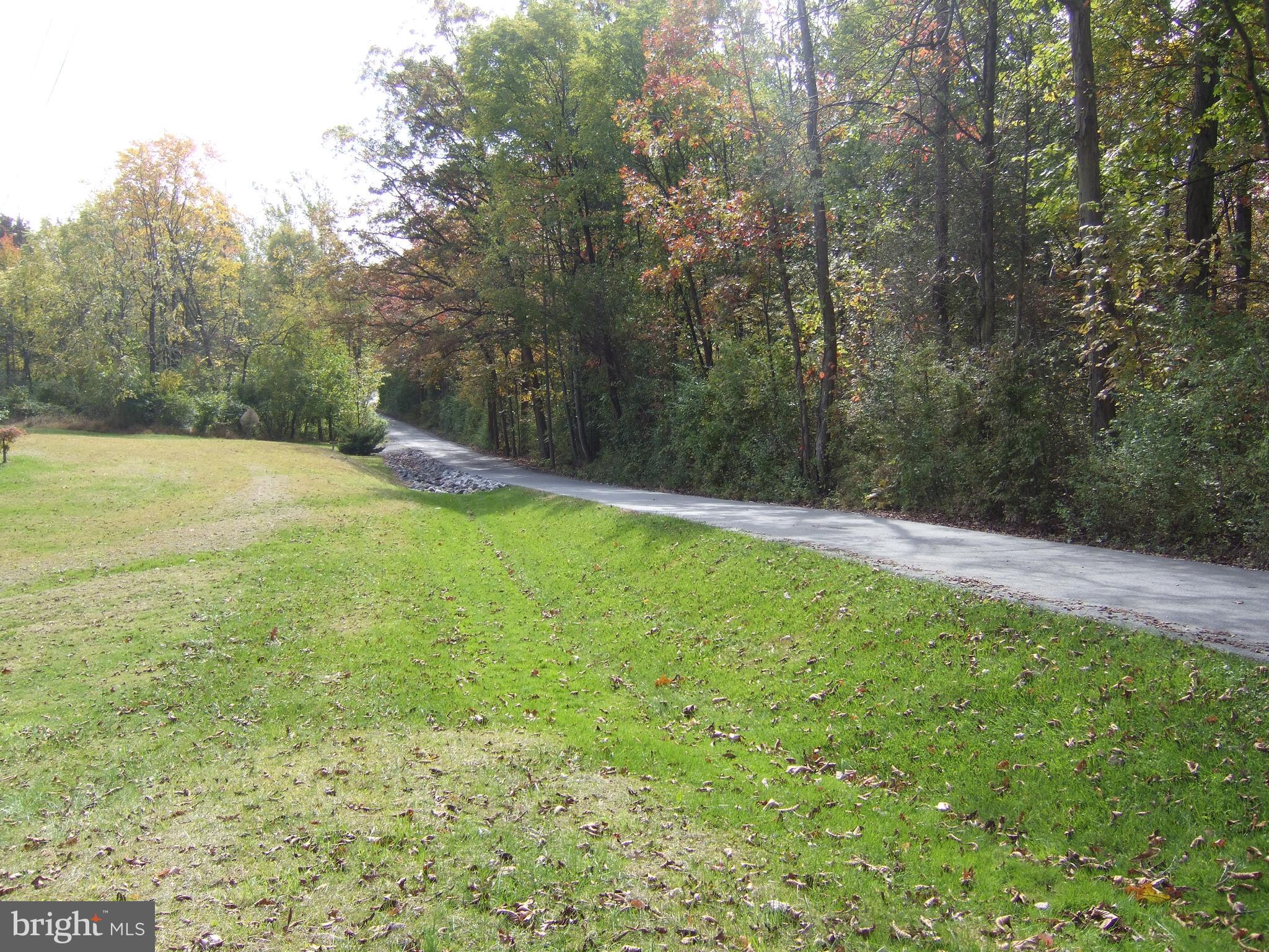1265H Swamp Bridge Road Denver, PA 17517 - Photo 11 of 13 a view of an outdoor space and swimming pool