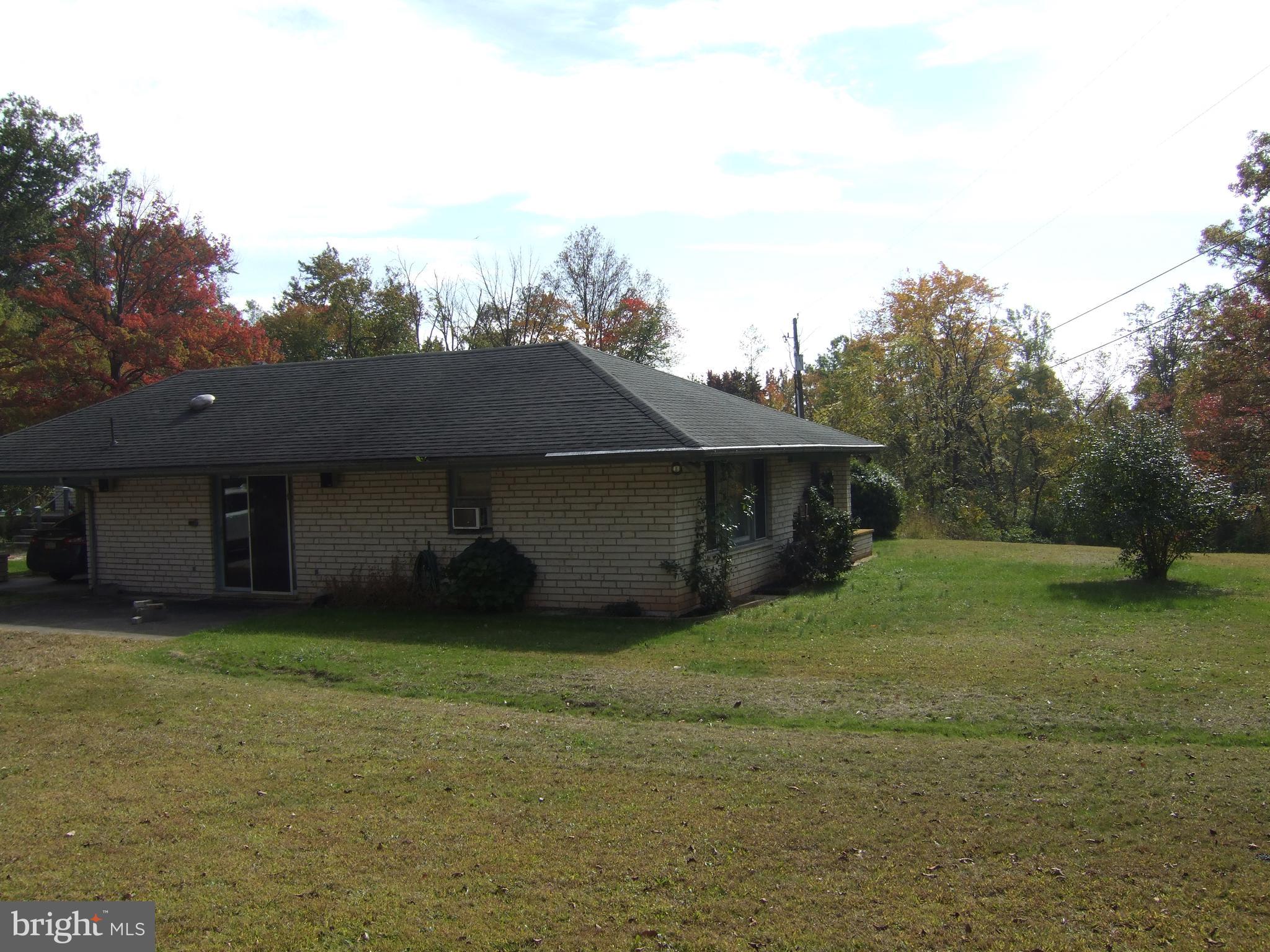 1265H Swamp Bridge Road Denver, PA 17517 - Photo 2 of 13 a house view with a outdoor space