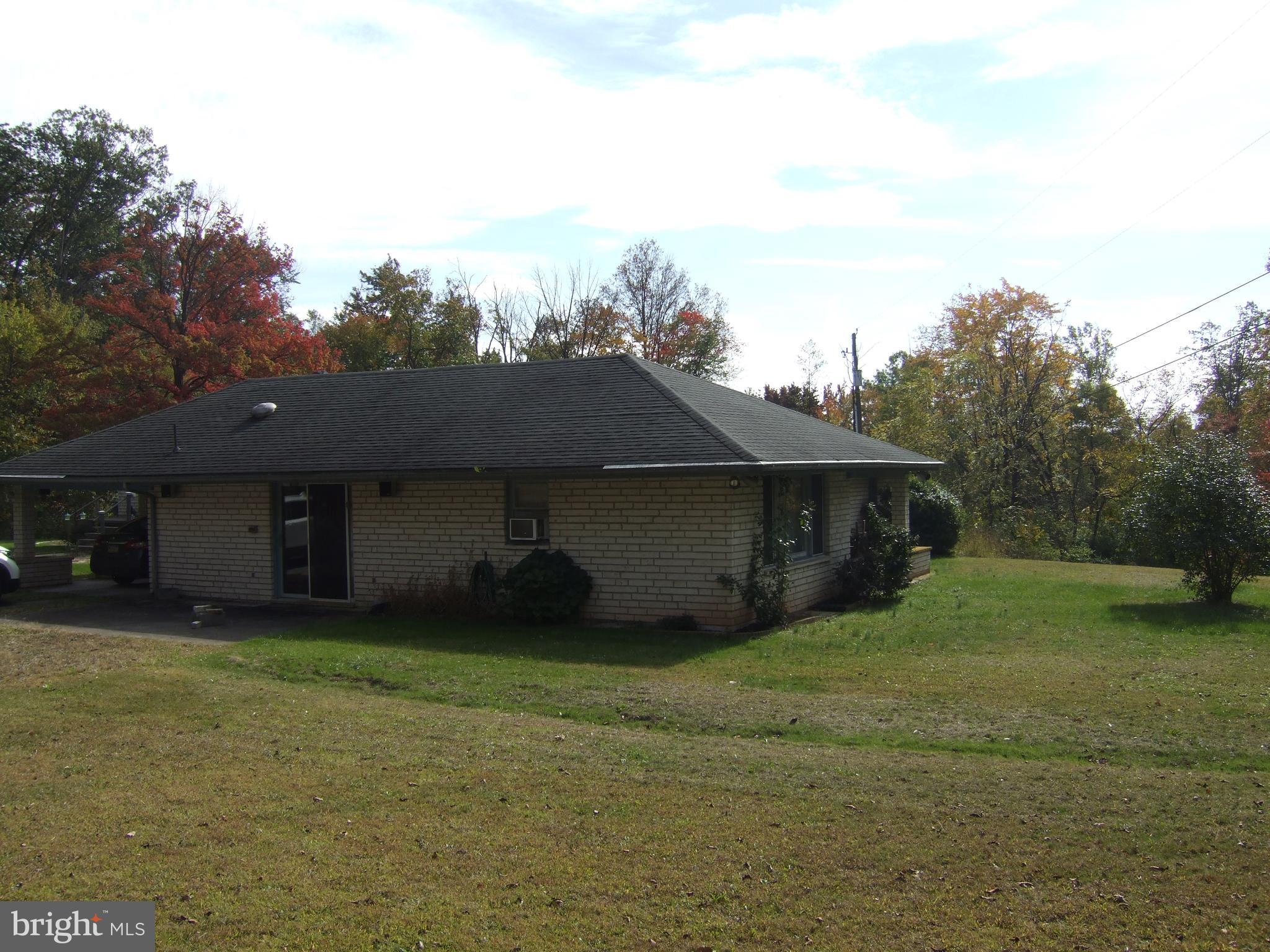 1265H Swamp Bridge Road Denver, PA 17517 - Photo 3 of 13 a house view with a garden