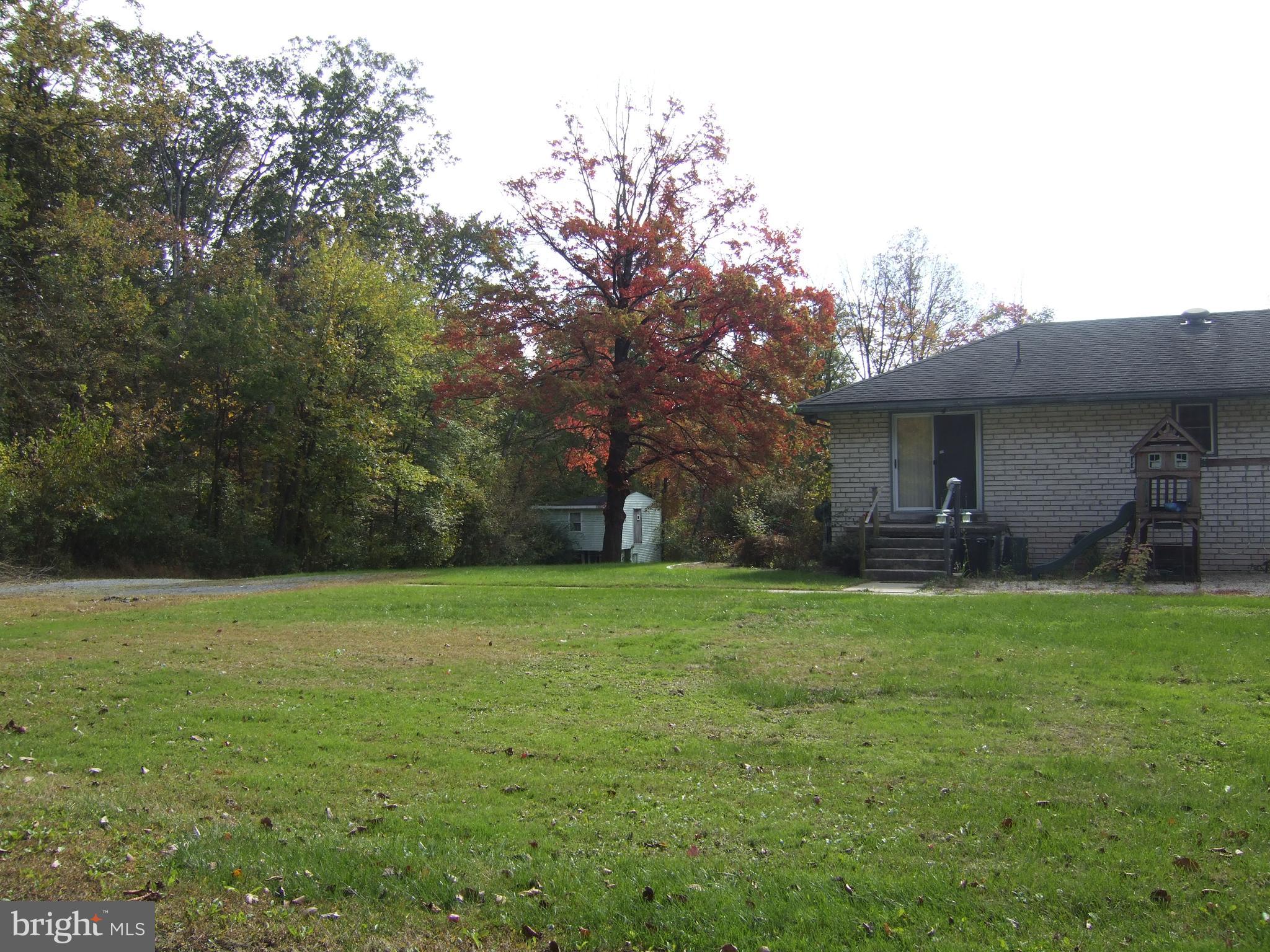 1265H Swamp Bridge Road Denver, PA 17517 - Photo 5 of 13 a backyard of a house with lots of green space