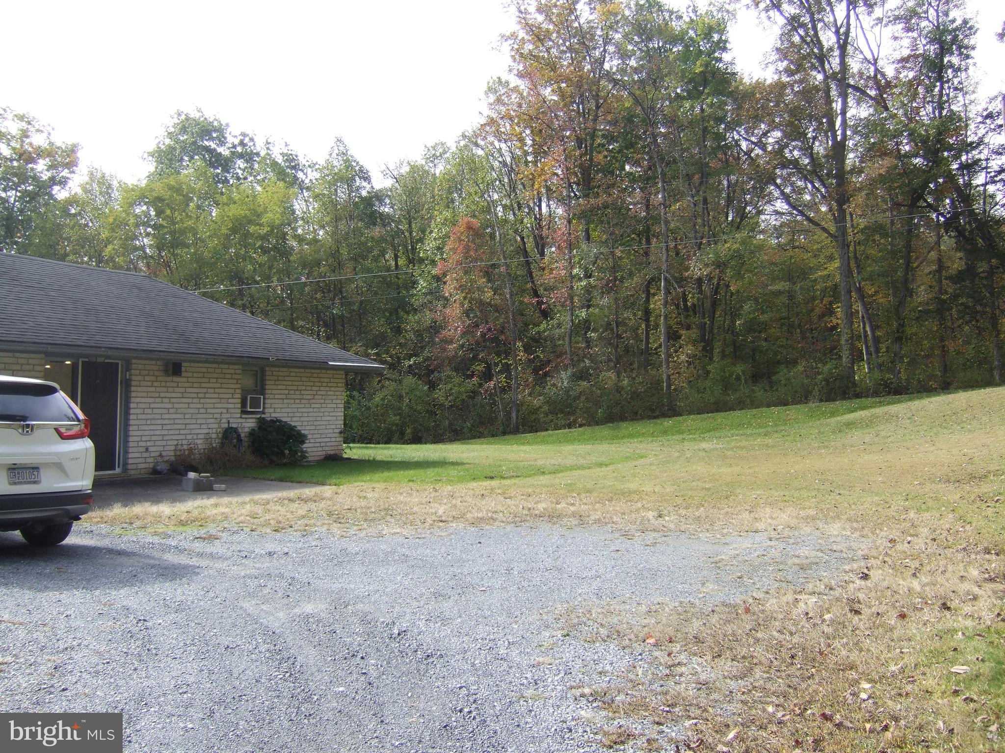 1265H Swamp Bridge Road Denver, PA 17517 - Photo 6 of 13 a view of a house with backyard