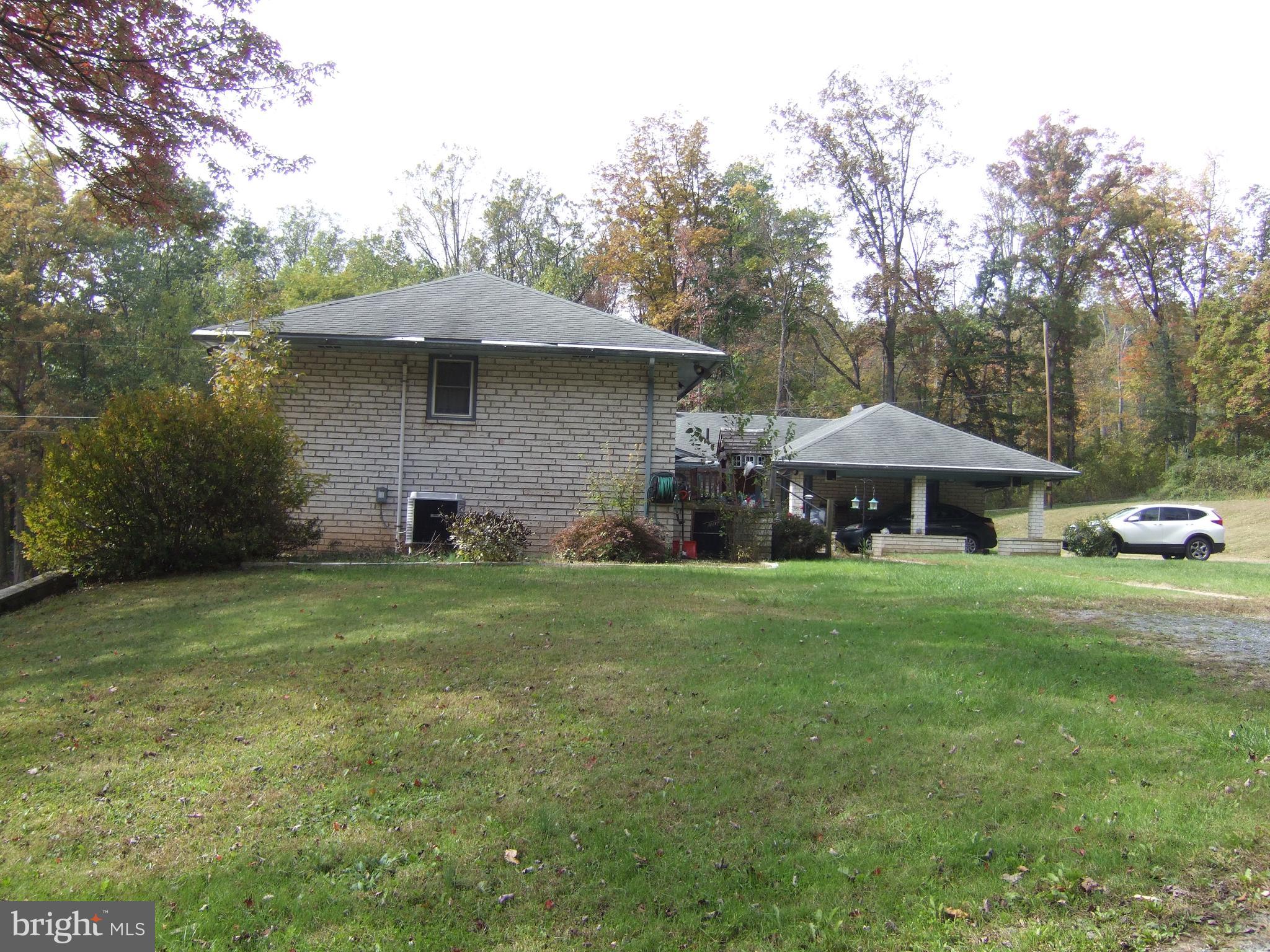 1265H Swamp Bridge Road Denver, PA 17517 - Photo 8 of 13 a backyard of a house with table and chairs