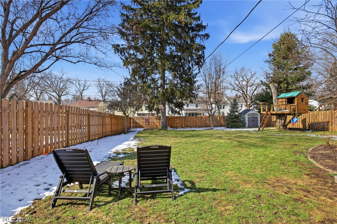 1390 Brainard Road Lyndhurst, OH 44124 - Photo 30 of 33 Fenced backyard with a storage shed and a playground