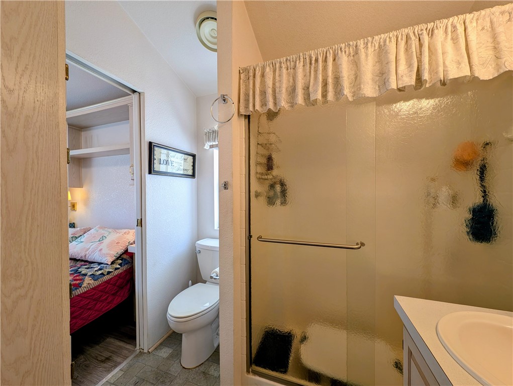 2000 Ramar Road, Unit 280 Bullhead City, AZ 86442 - Photo 35 of 63 a bathroom with a toilet and a shower