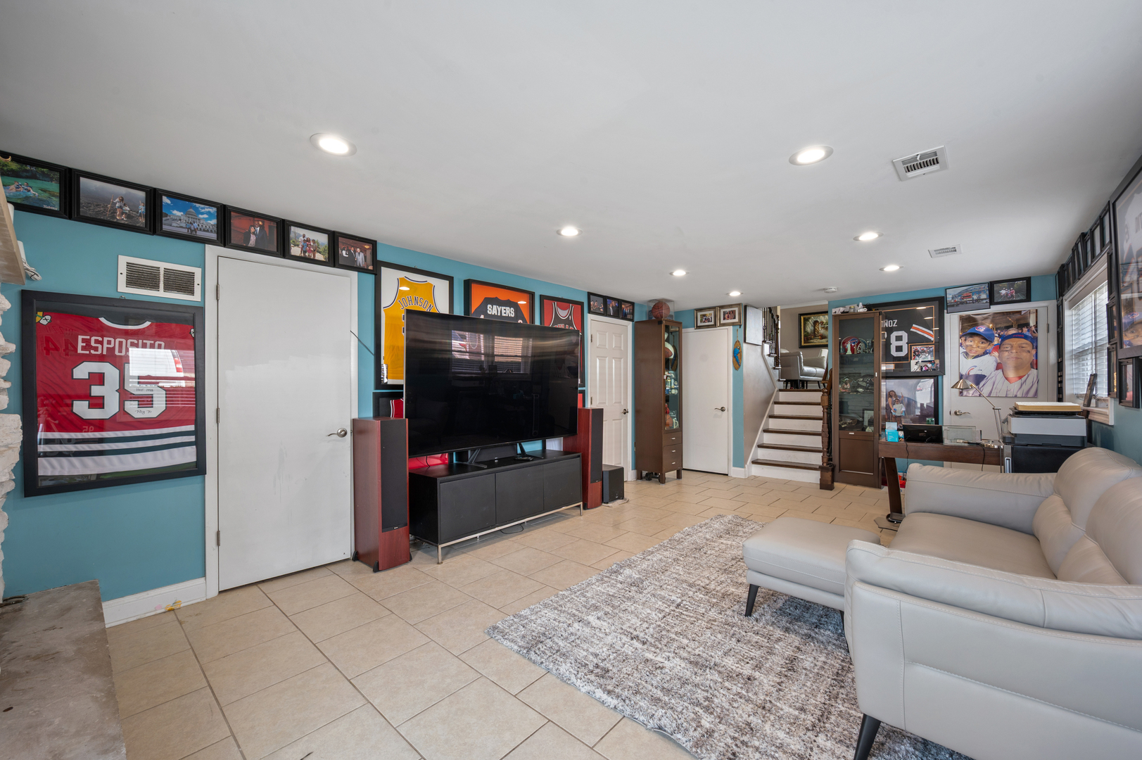 8426 West Betty Terrace Niles, IL 60714 - Photo 11 of 40 a living room with furniture and a flat screen tv