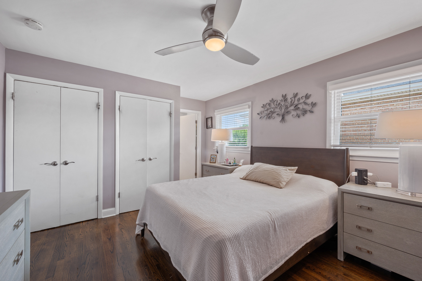 8426 West Betty Terrace Niles, IL 60714 - Photo 14 of 40 a bedroom with a bed and a chandelier