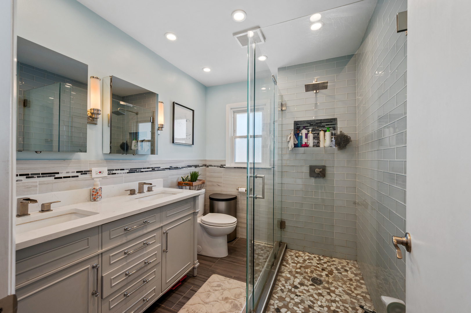 8426 West Betty Terrace Niles, IL 60714 - Photo 15 of 40 a bathroom with a double vanity sink toilet and shower