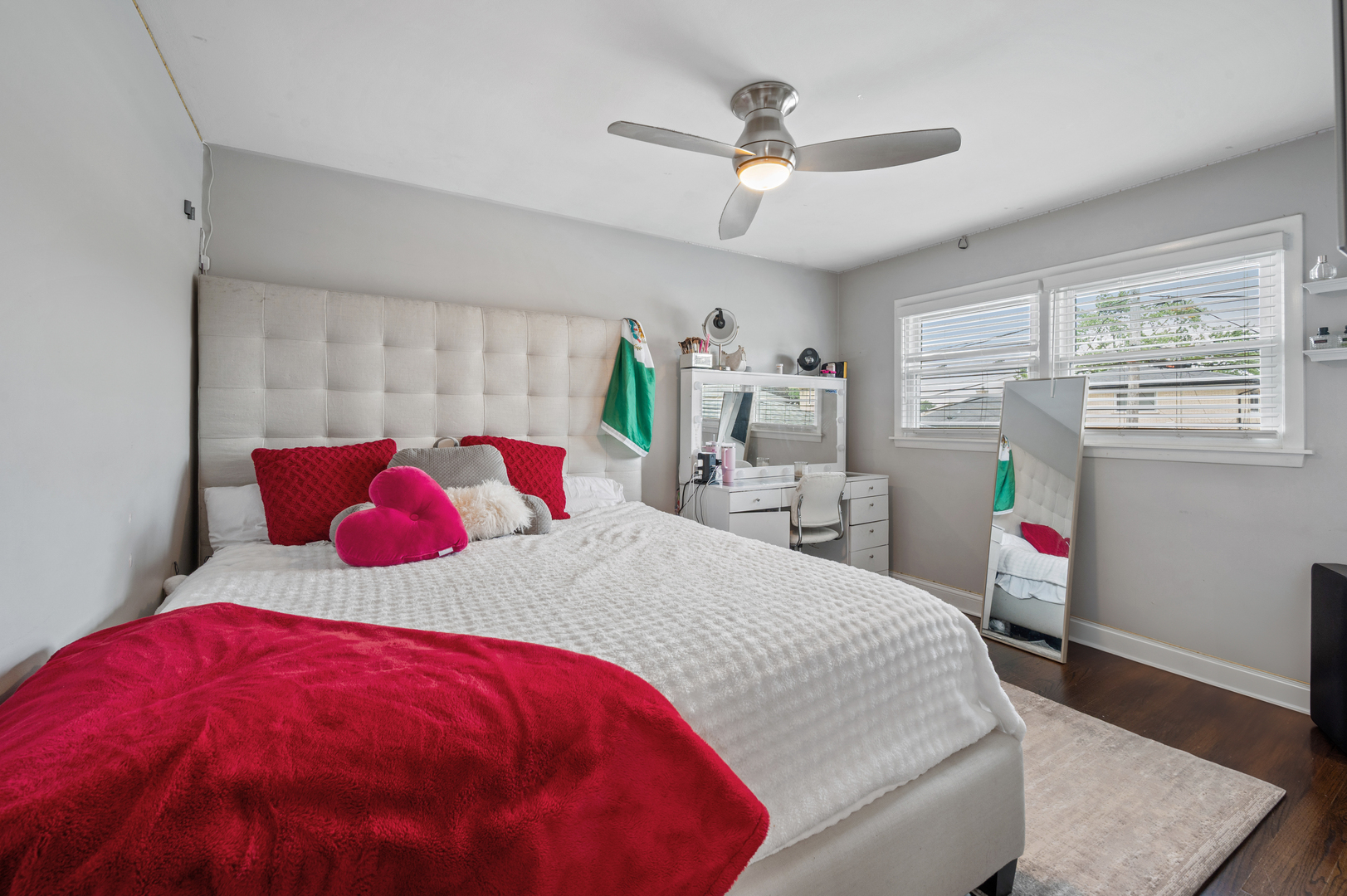 8426 West Betty Terrace Niles, IL 60714 - Photo 16 of 40 a bedroom with a large bed and a chandelier