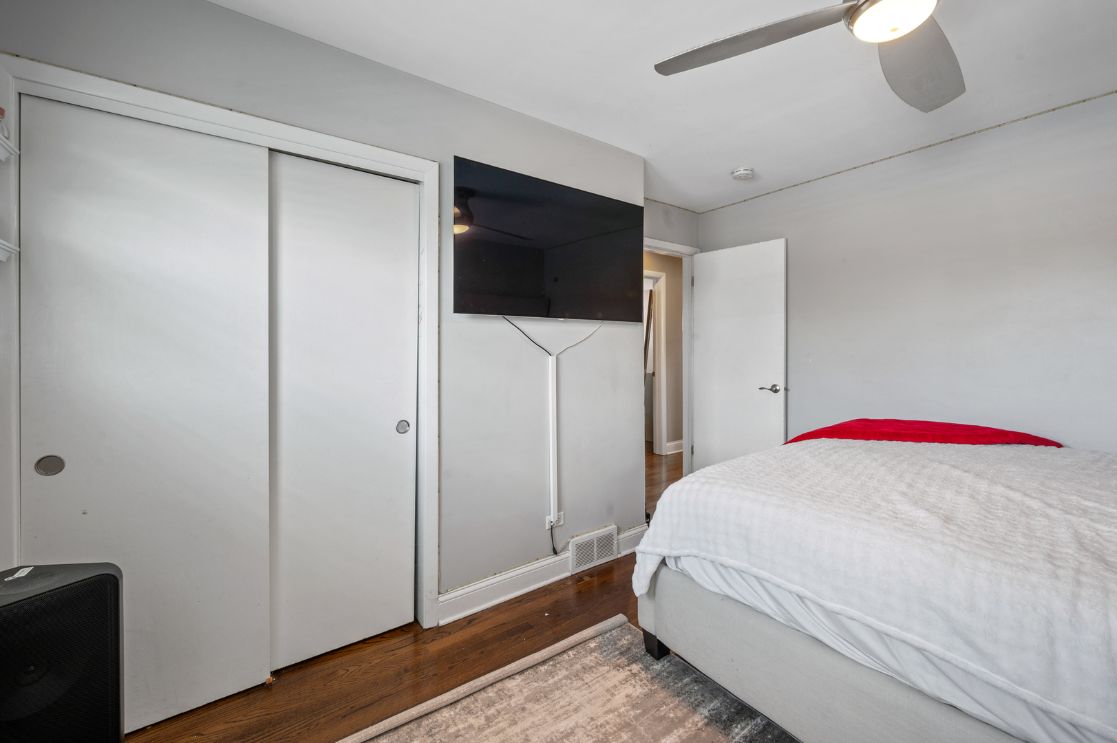 8426 West Betty Terrace Niles, IL 60714 - Photo 17 of 40 a bedroom with a bed and a flat screen tv