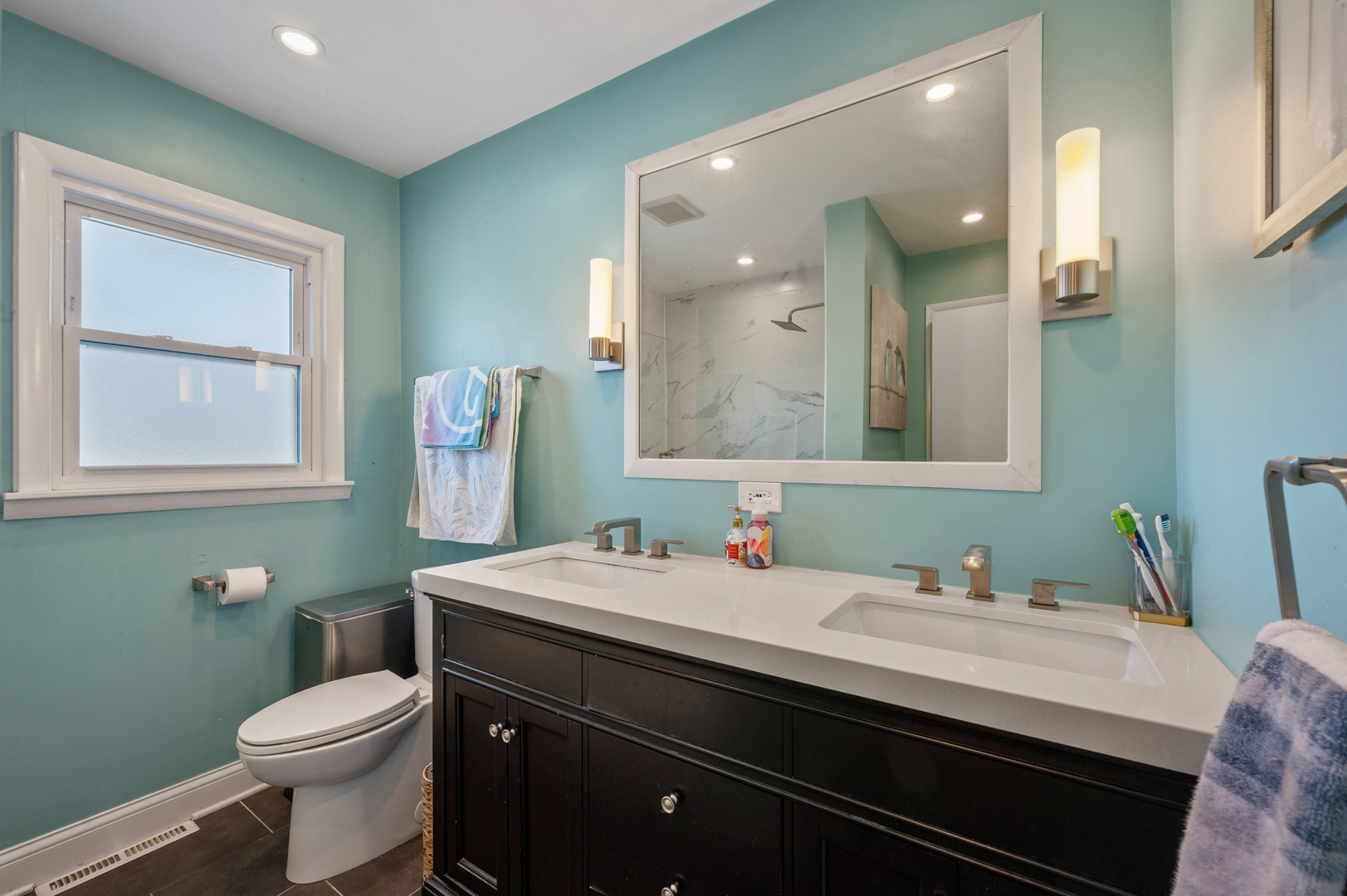8426 West Betty Terrace Niles, IL 60714 - Photo 18 of 40 a bathroom with a sink a toilet and mirror