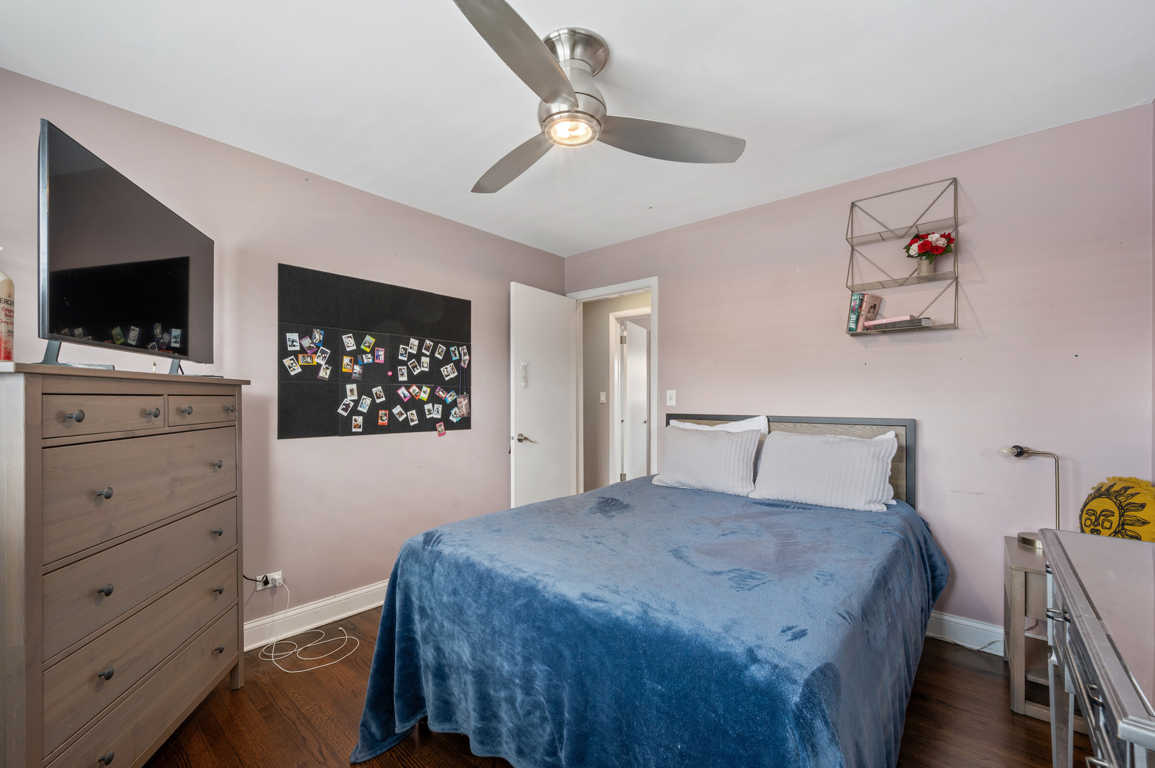 8426 West Betty Terrace Niles, IL 60714 - Photo 21 of 40 a bedroom with a bed and a flat screen tv