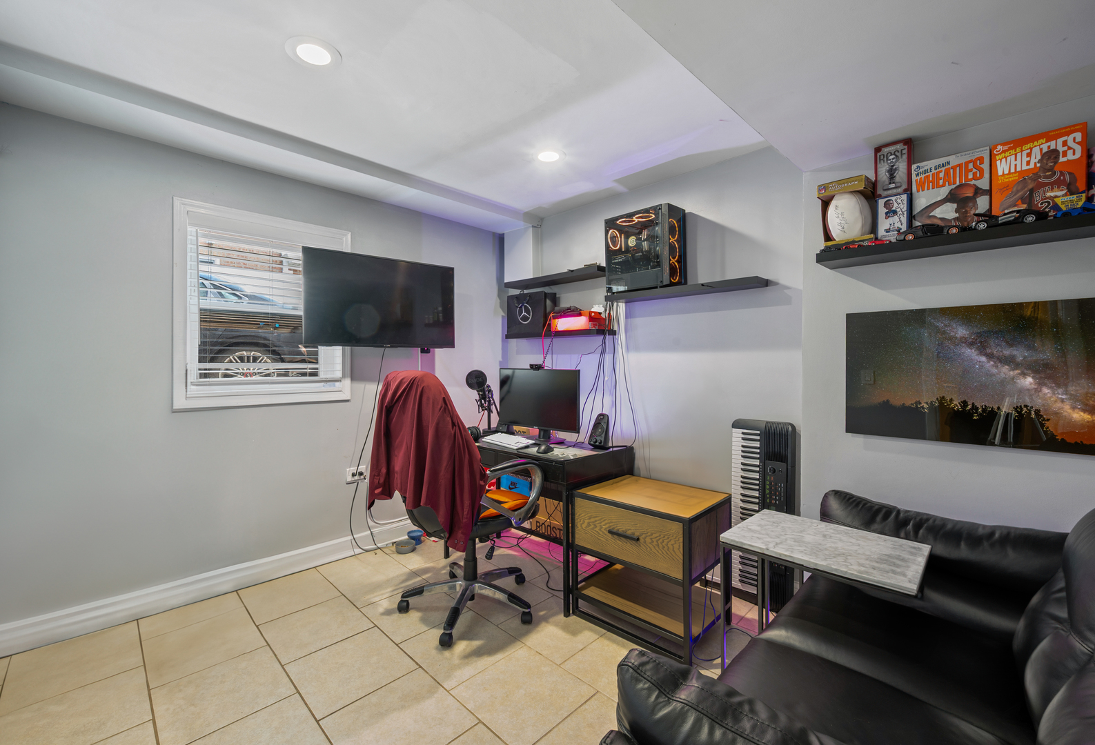 8426 West Betty Terrace Niles, IL 60714 - Photo 23 of 40 a workspace with furniture and flat screen tv