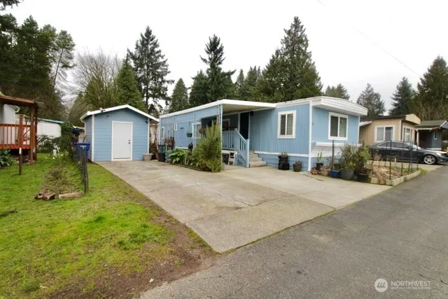 a front view of a house with yard