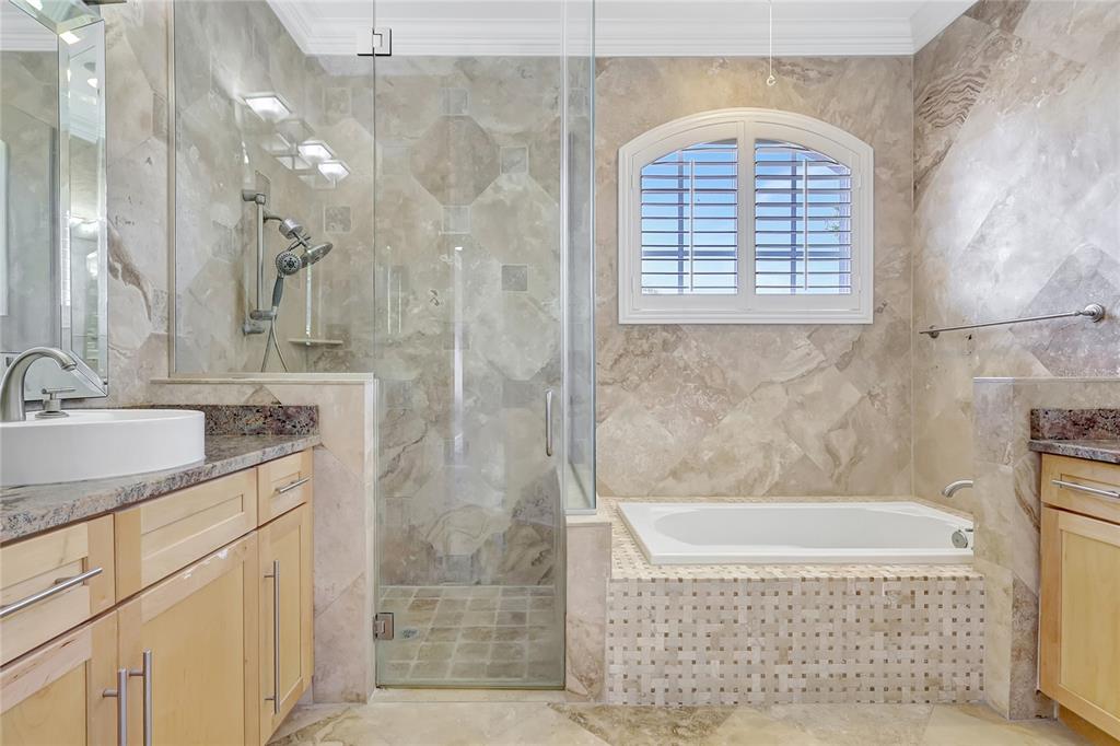 2863 Duncan Tree Circle Valrico, FL 33594 - Photo 46 of 53 a bathroom with a granite countertop sink a bathtub and shower