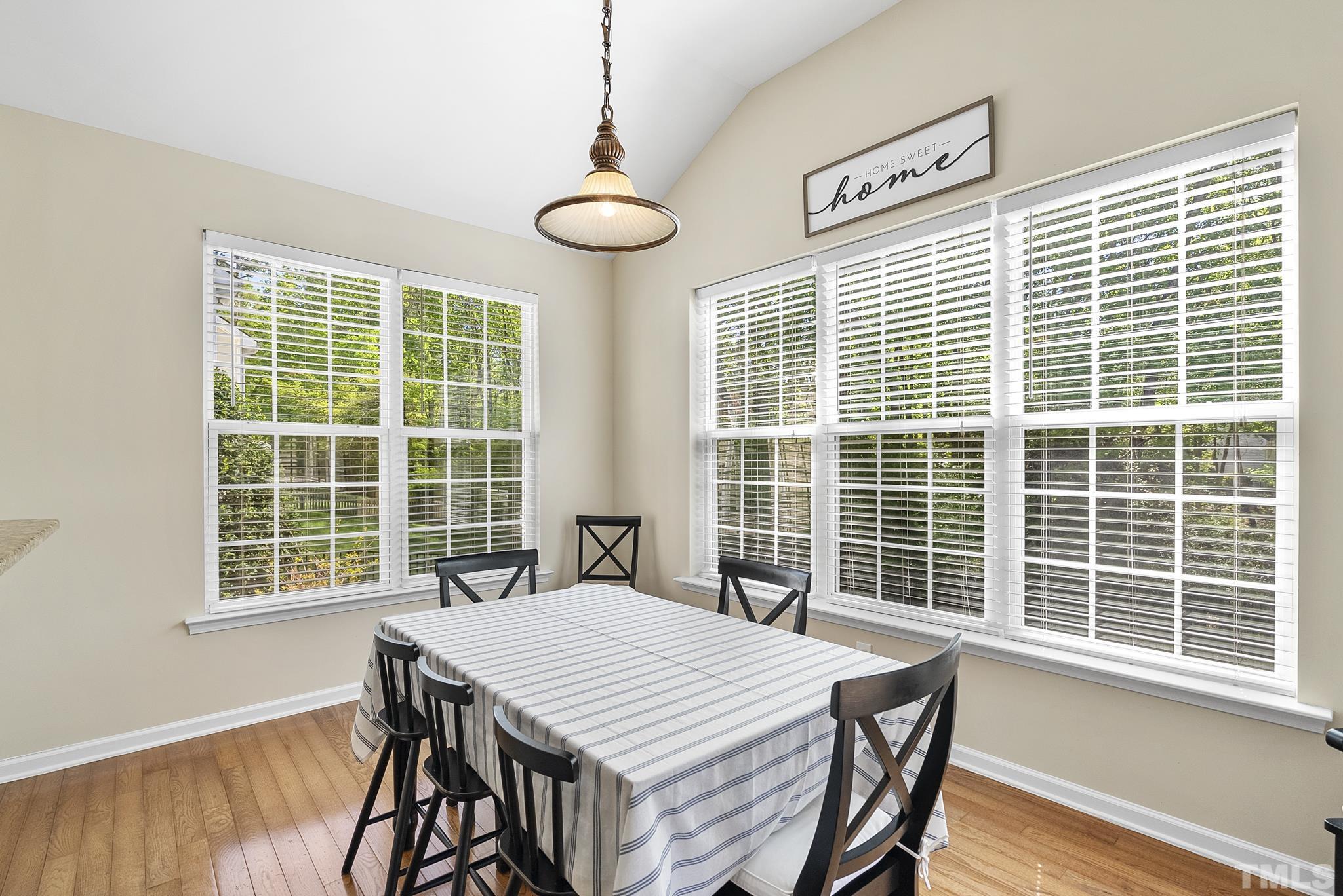 213 Forbes Road Wake Forest, NC 27587 - Photo 16 of 41 a view of a dining room with furniture and windows