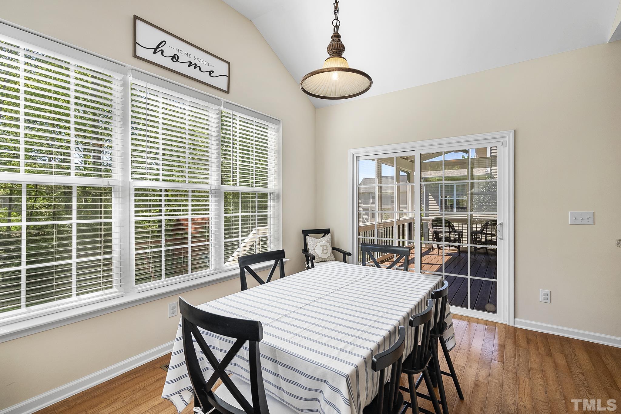 213 Forbes Road Wake Forest, NC 27587 - Photo 17 of 41 a view of a dining room with furniture window and wooden floor