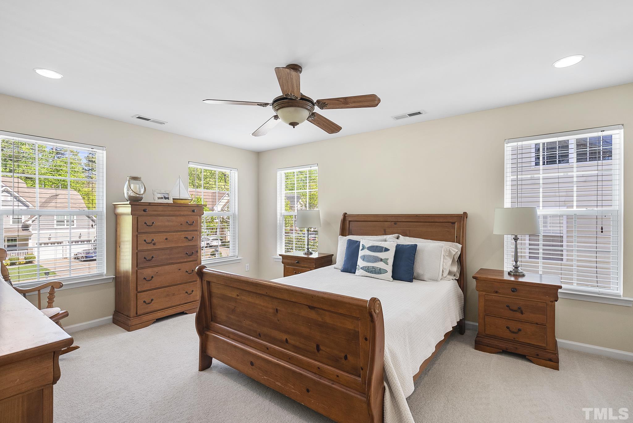 213 Forbes Road Wake Forest, NC 27587 - Photo 19 of 41 a bedroom with a bed and a dresser