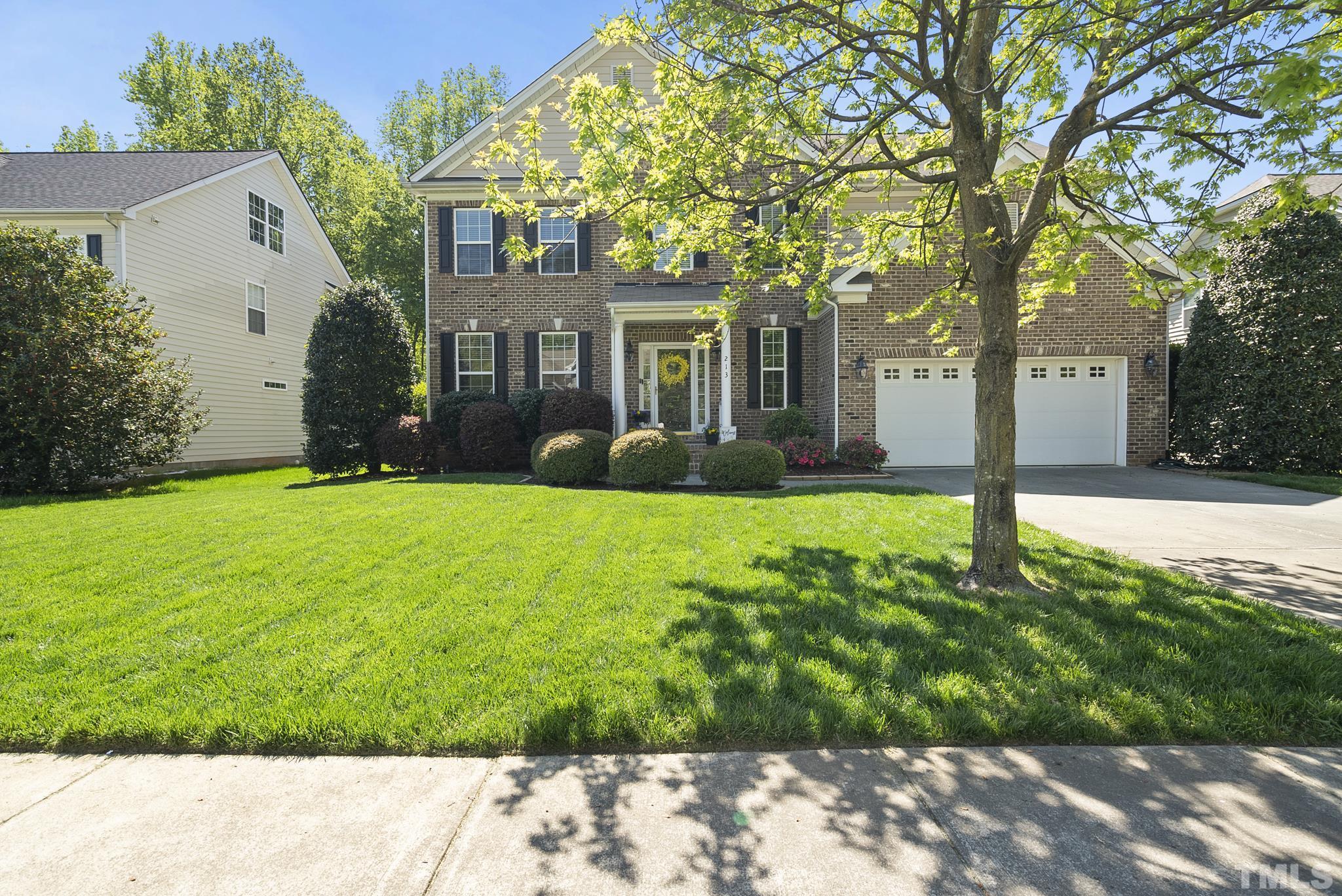 213 Forbes Road Wake Forest, NC 27587 - Photo 2 of 41 a front view of a house with yard and green space