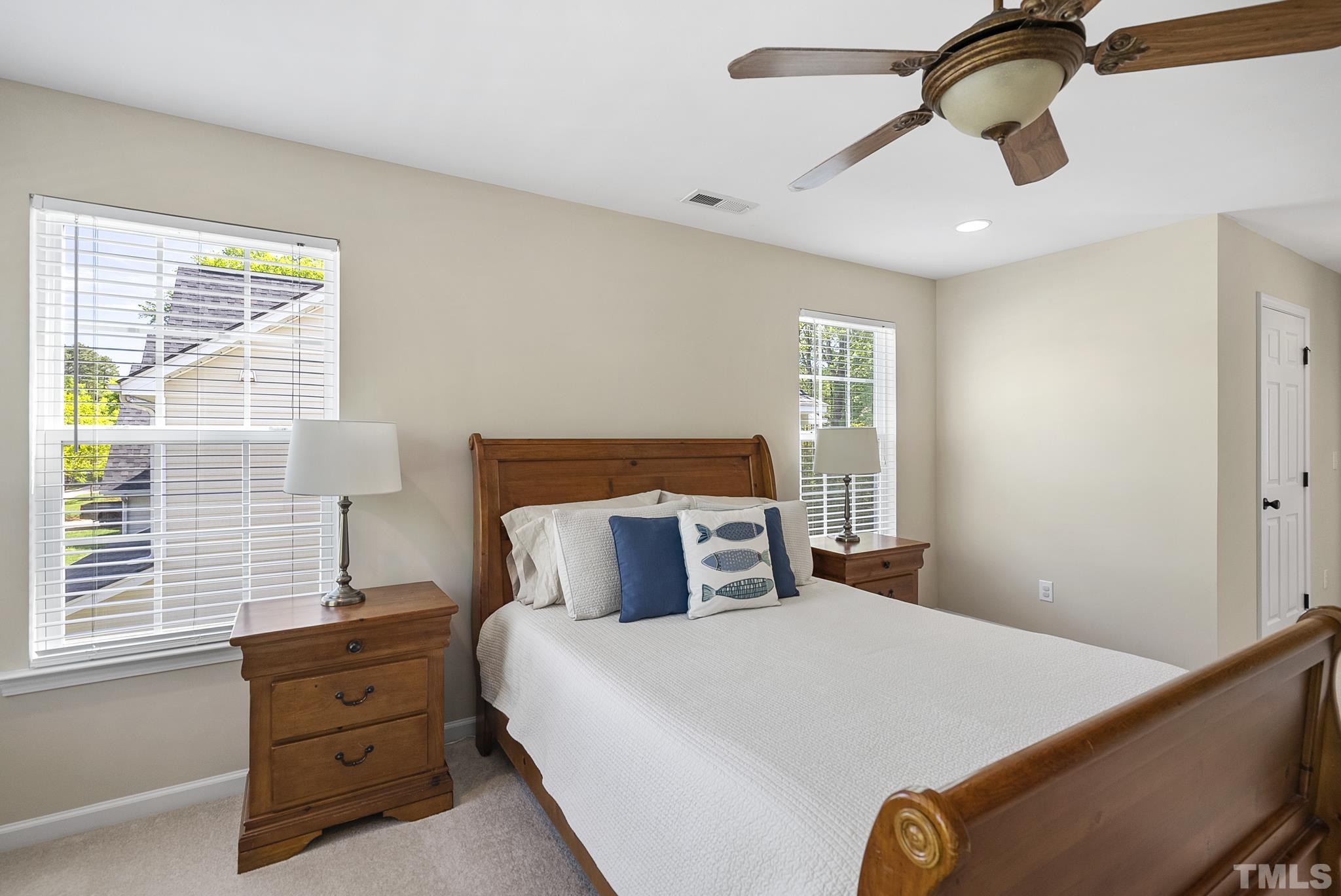 213 Forbes Road Wake Forest, NC 27587 - Photo 21 of 41 a bedroom with a large bed and a window