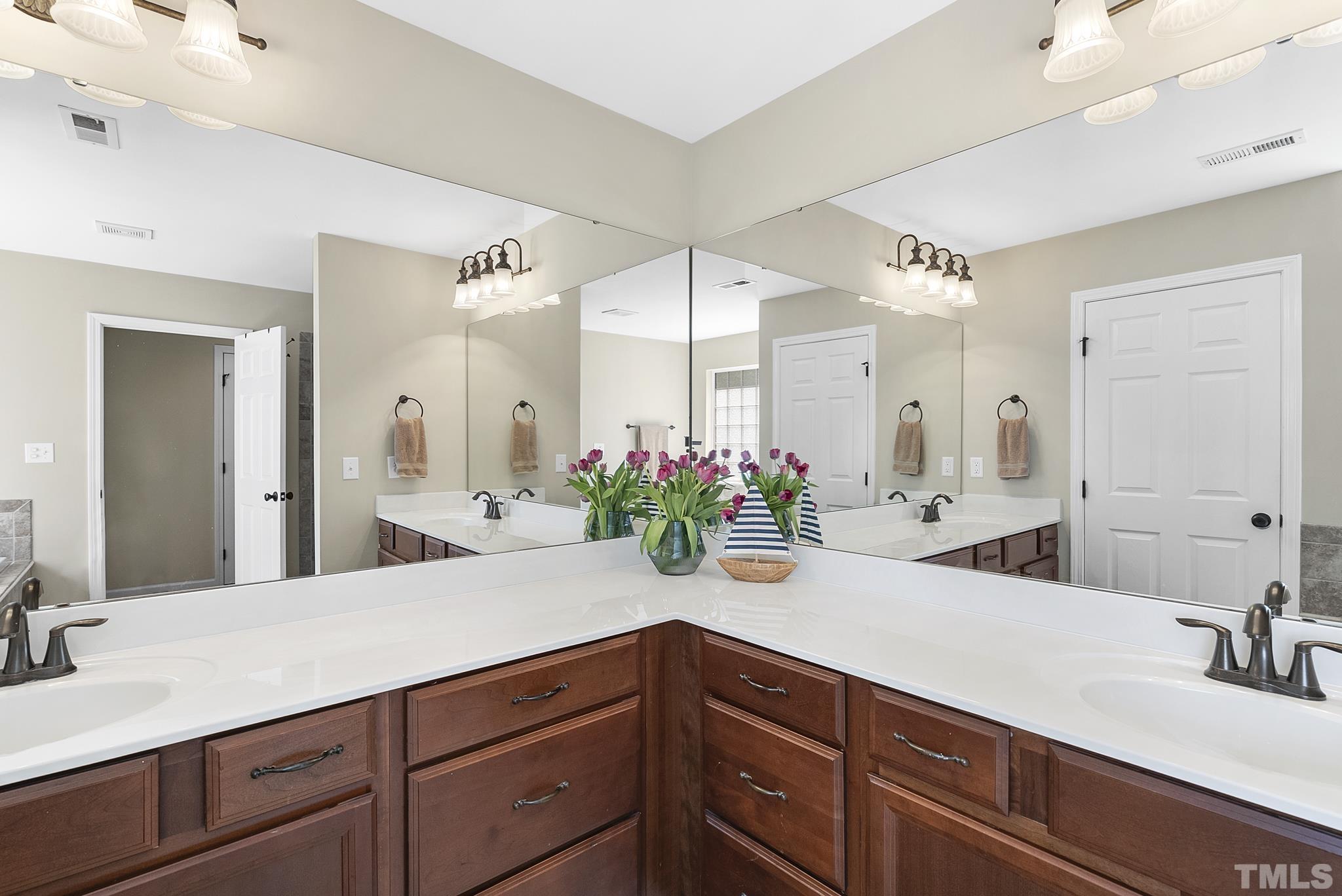 213 Forbes Road Wake Forest, NC 27587 - Photo 22 of 41 a bathroom with a sink and a mirror