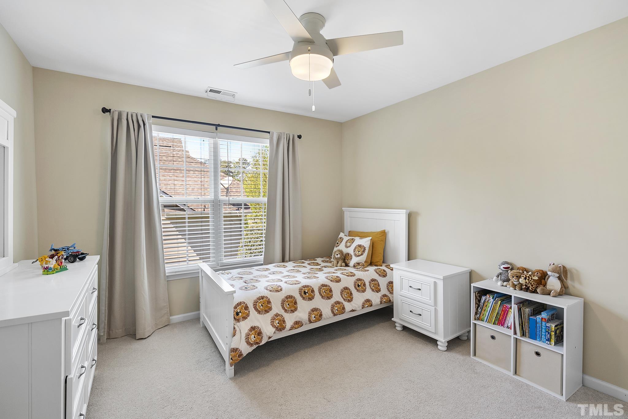 213 Forbes Road Wake Forest, NC 27587 - Photo 25 of 41 a bedroom with bed and a window