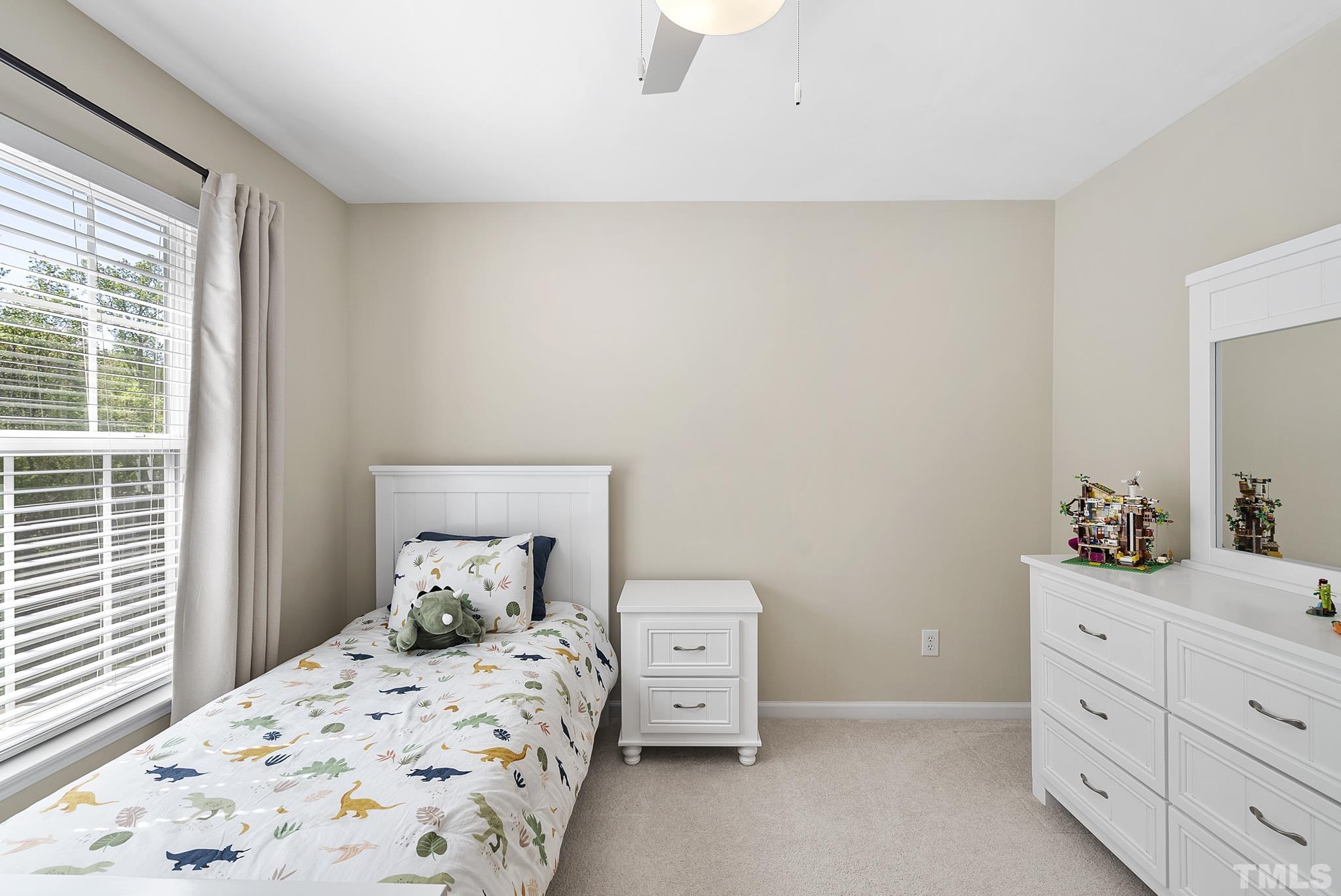 213 Forbes Road Wake Forest, NC 27587 - Photo 30 of 41 a bedroom with a bed and a dresser