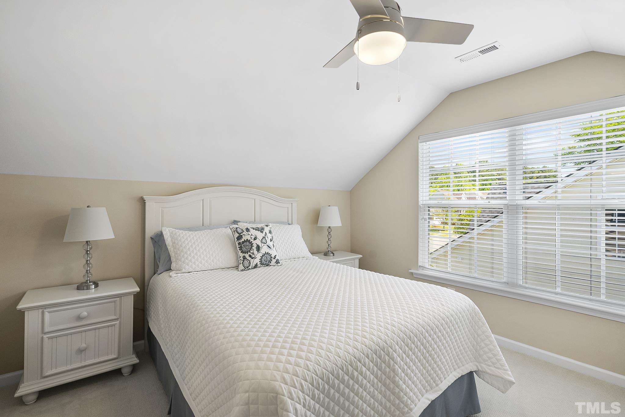 213 Forbes Road Wake Forest, NC 27587 - Photo 33 of 41 a bedroom with a bed and a large window