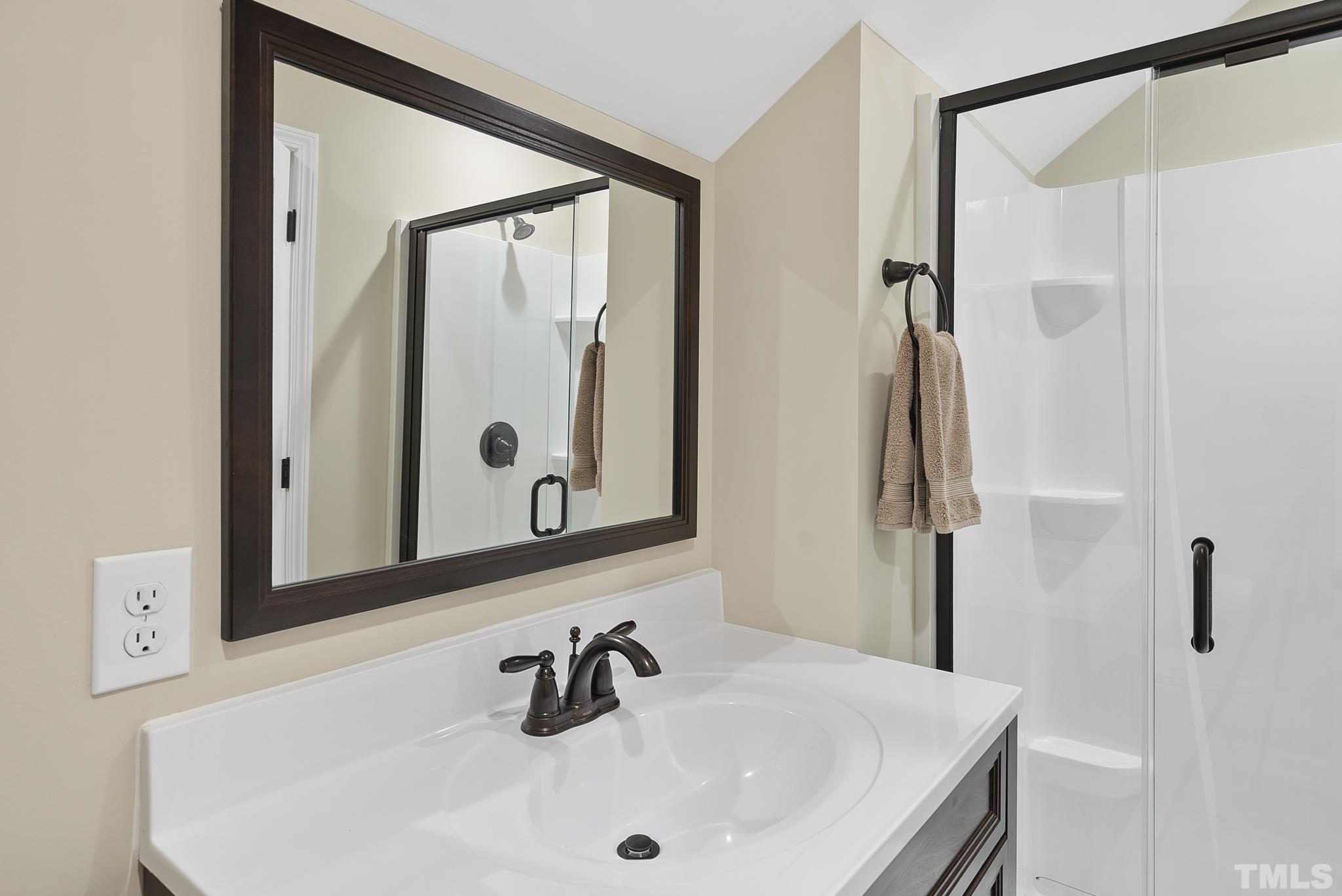 213 Forbes Road Wake Forest, NC 27587 - Photo 35 of 41 a bathroom with a sink and a mirror