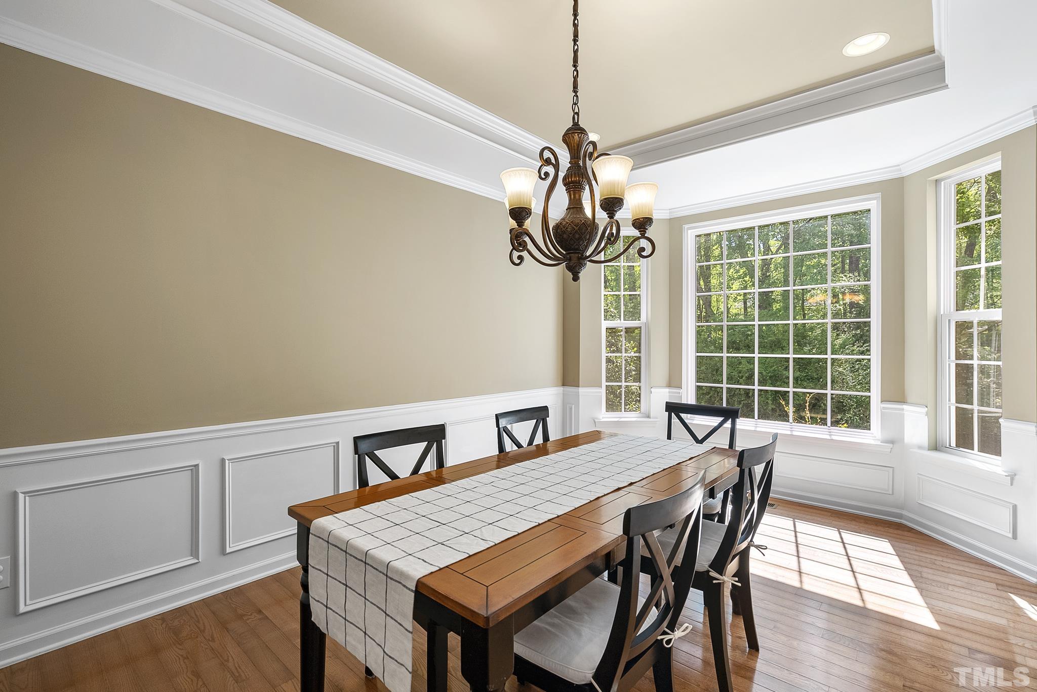213 Forbes Road Wake Forest, NC 27587 - Photo 5 of 41 a view of a dining room with furniture window and wooden floor