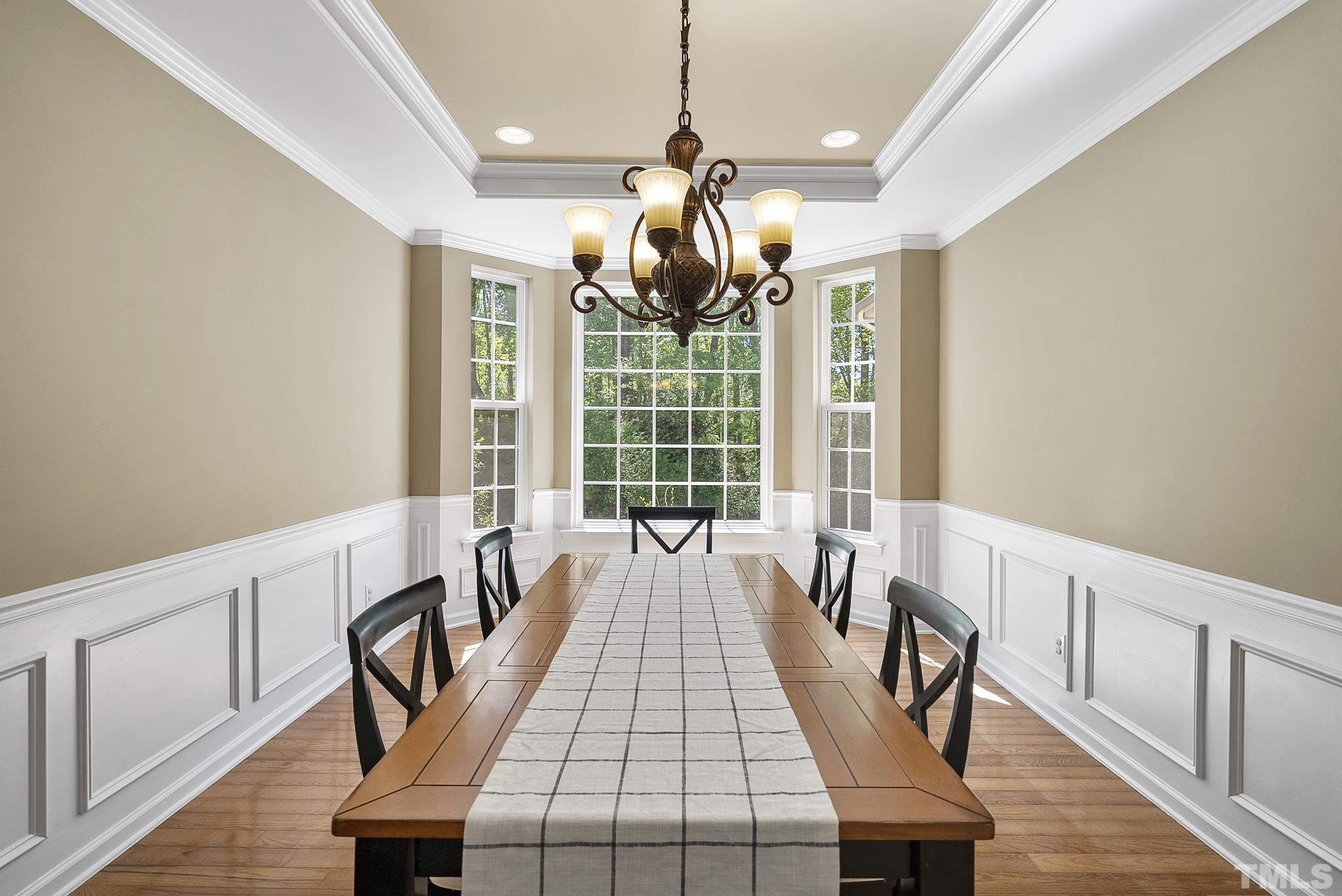213 Forbes Road Wake Forest, NC 27587 - Photo 6 of 41 a view of a dining room with furniture window and wooden floor