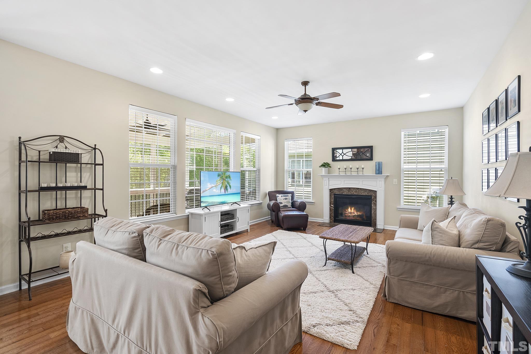 213 Forbes Road Wake Forest, NC 27587 - Photo 7 of 41 a living room with furniture and a fireplace