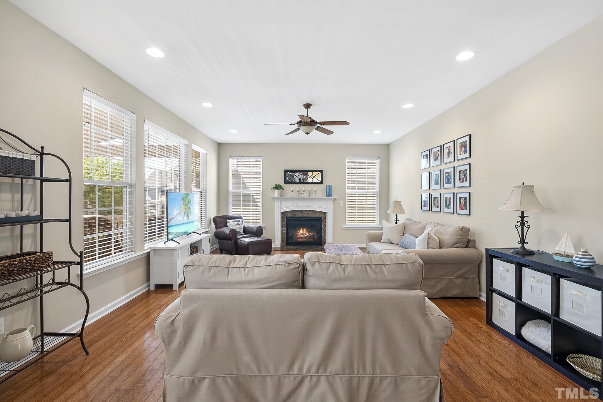 213 Forbes Road Wake Forest, NC 27587 - Photo 8 of 41 a living room with furniture large window and fireplace